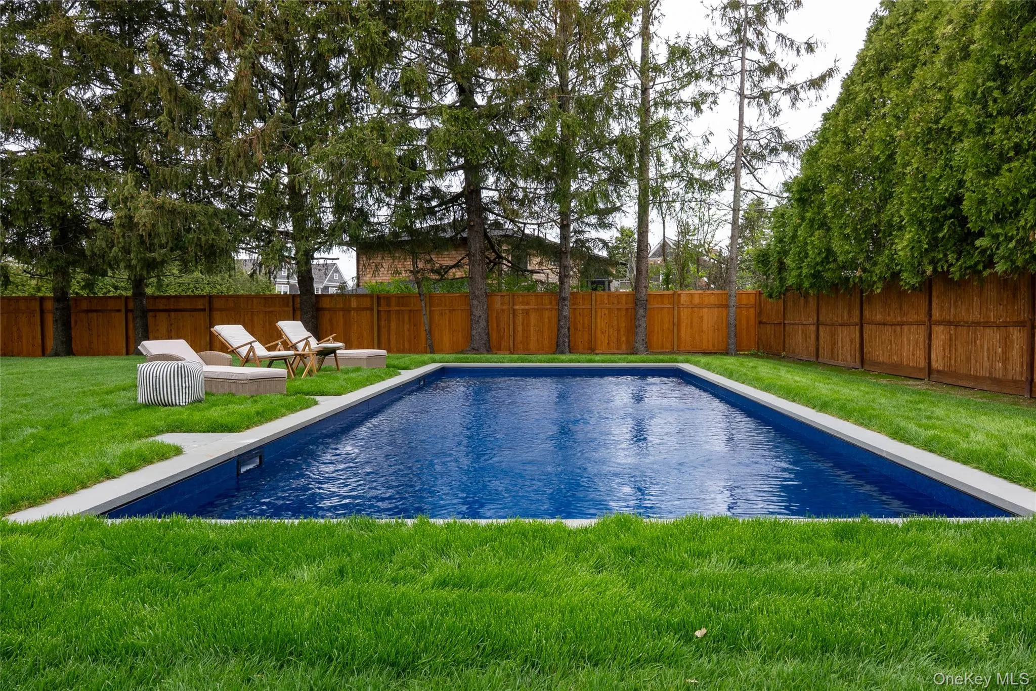 View of swimming pool with a fenced backyard and a patio View of swimming pool with a fenced backyard and a patio