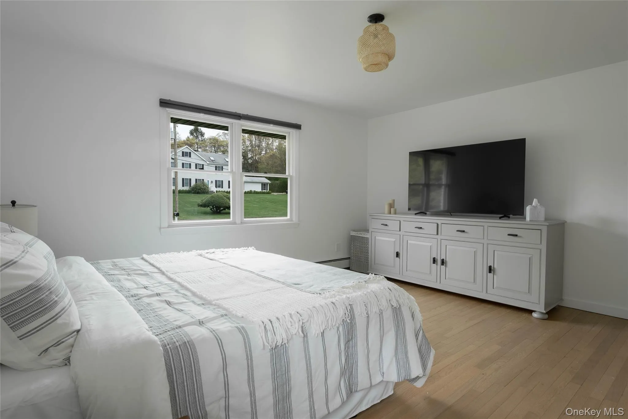 Bedroom featuring light wood-style floors Bedroom featuring light wood-style floors