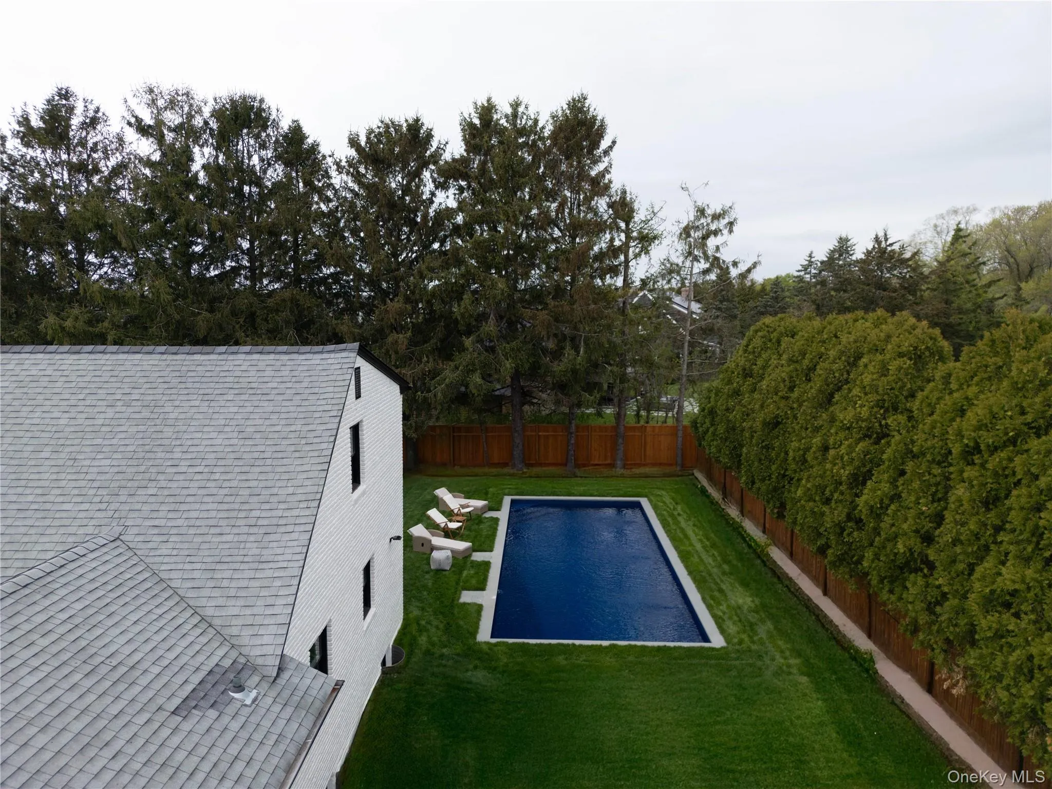 View of pool featuring a fenced backyard and a patio View of pool featuring a fenced backyard and a patio
