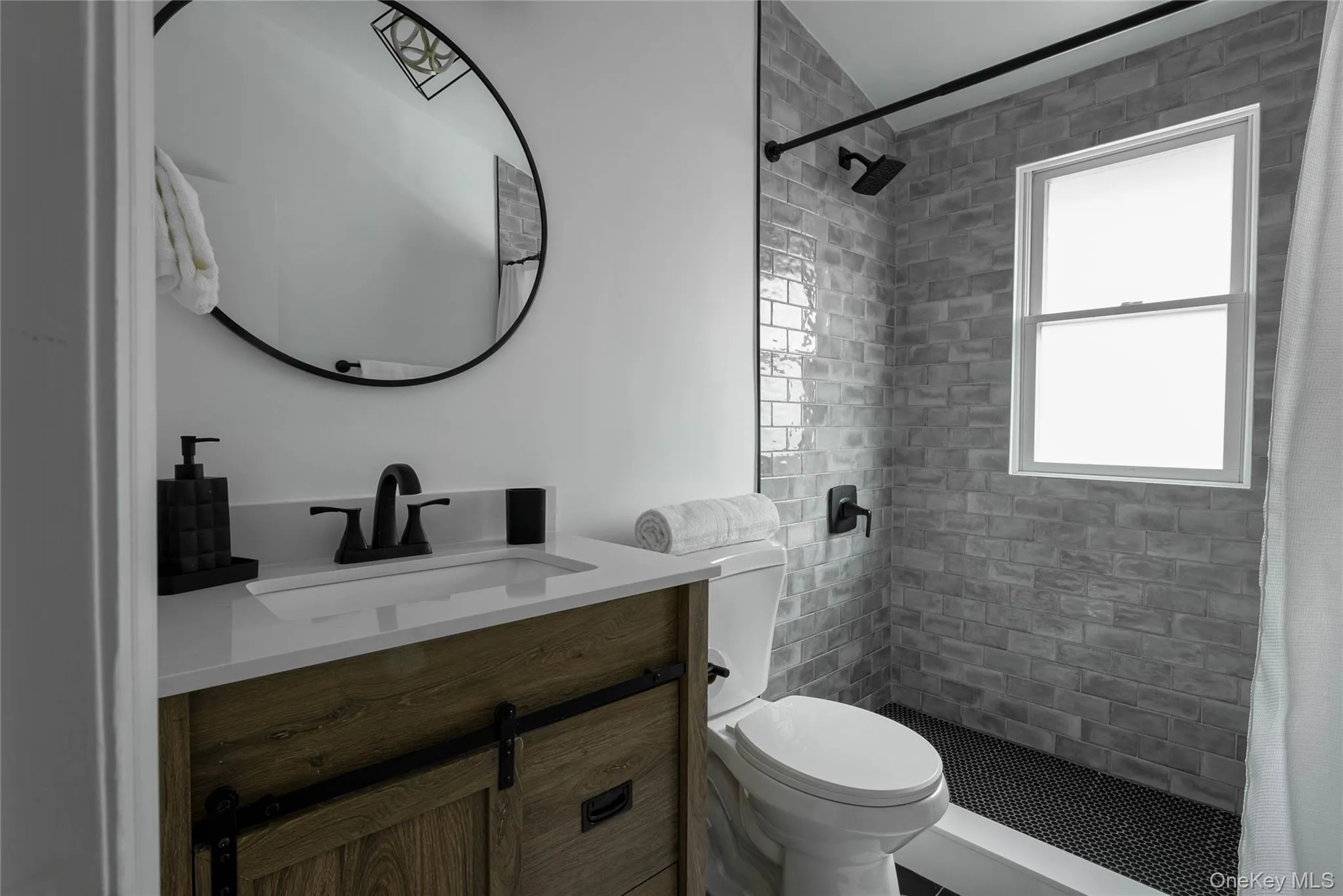 Full bath with vanity and a shower stall Full bath with vanity and a shower stall