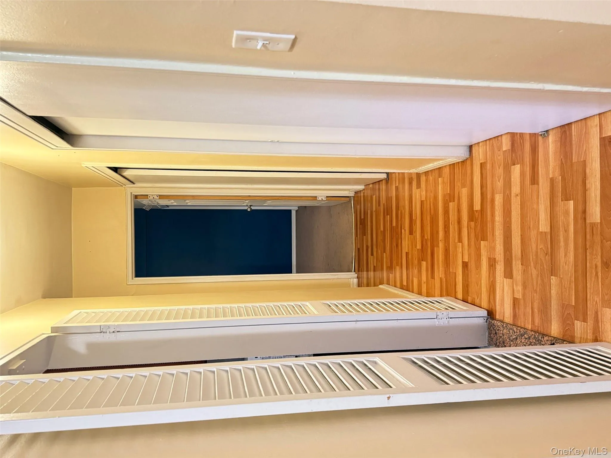 Hall with light wood finished floors and baseboards Hall with light wood finished floors and baseboards