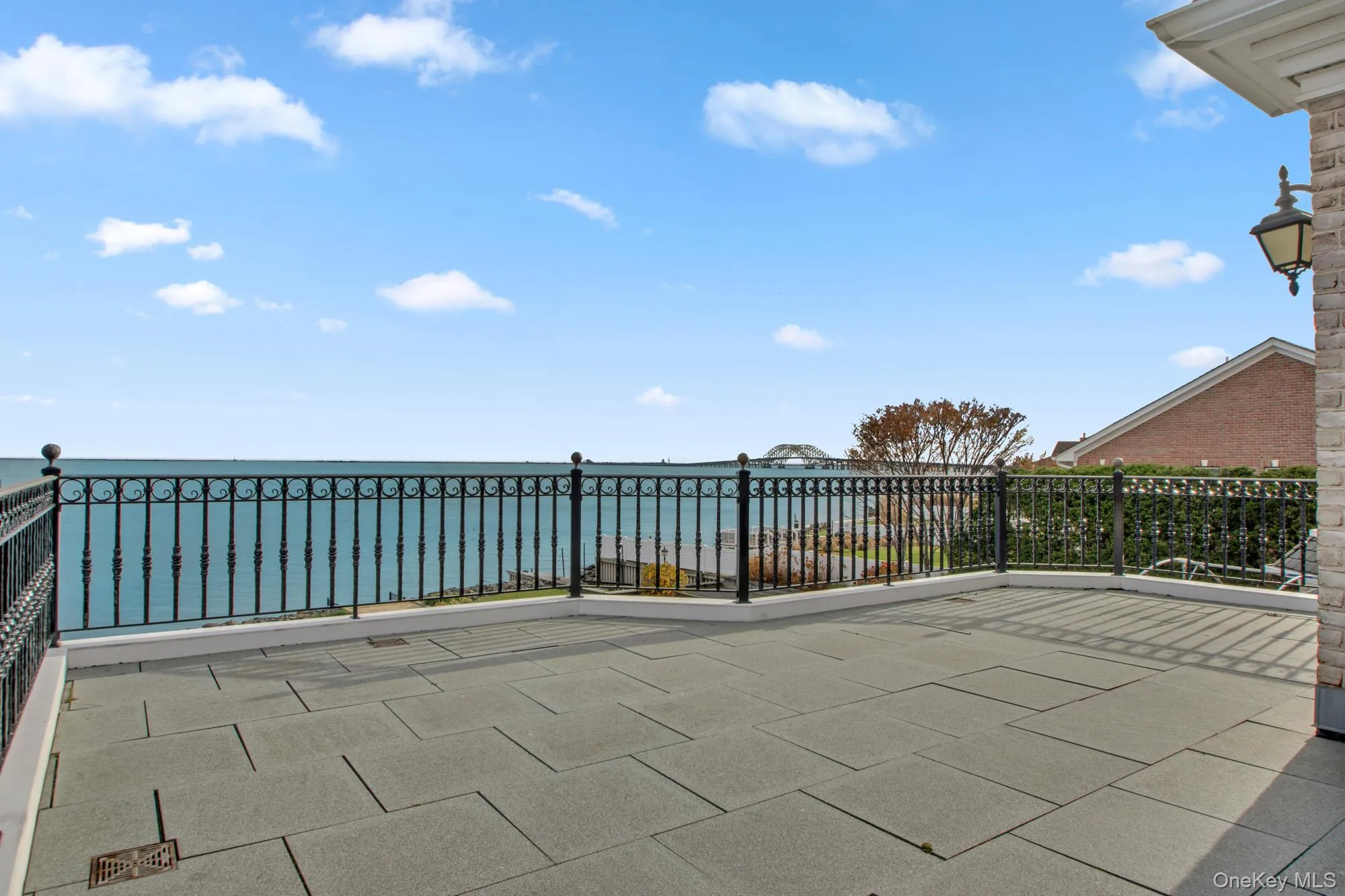 Upper terrace featuring a water view and outdoor FPLC Upper terrace featuring a water view and outdoor FPLC