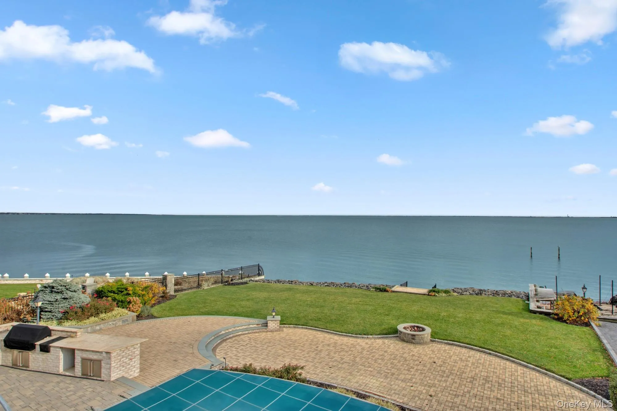 Water view featuring an outdoor fire pit Water view featuring an outdoor fire pit