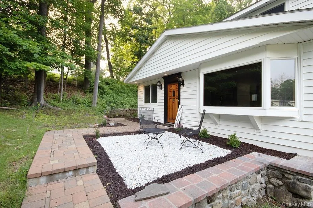 View of exterior entry with view of scattered trees View of exterior entry with view of scattered trees
