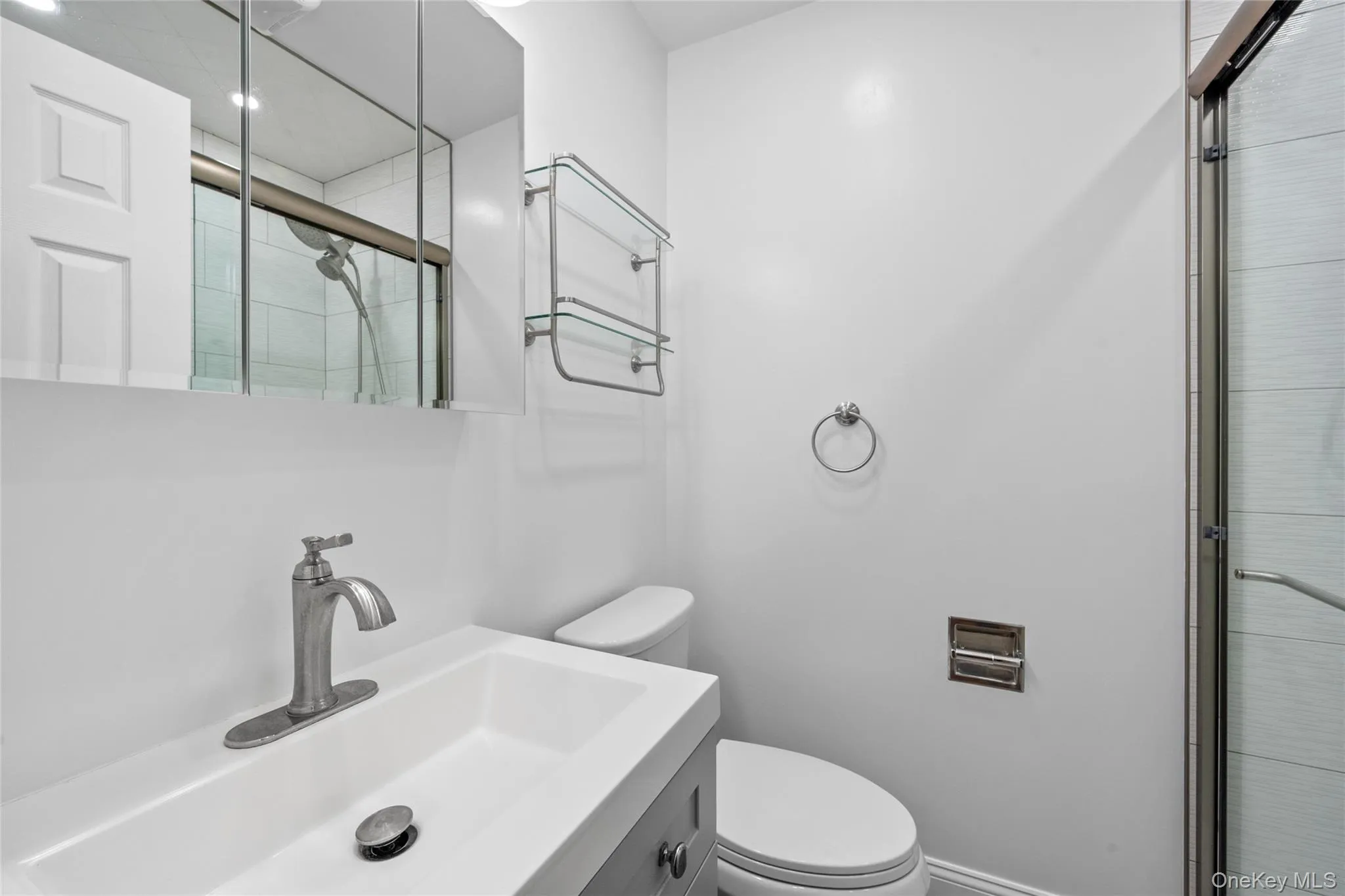 Full bath with an enclosed shower and vanity Full bath with an enclosed shower and vanity