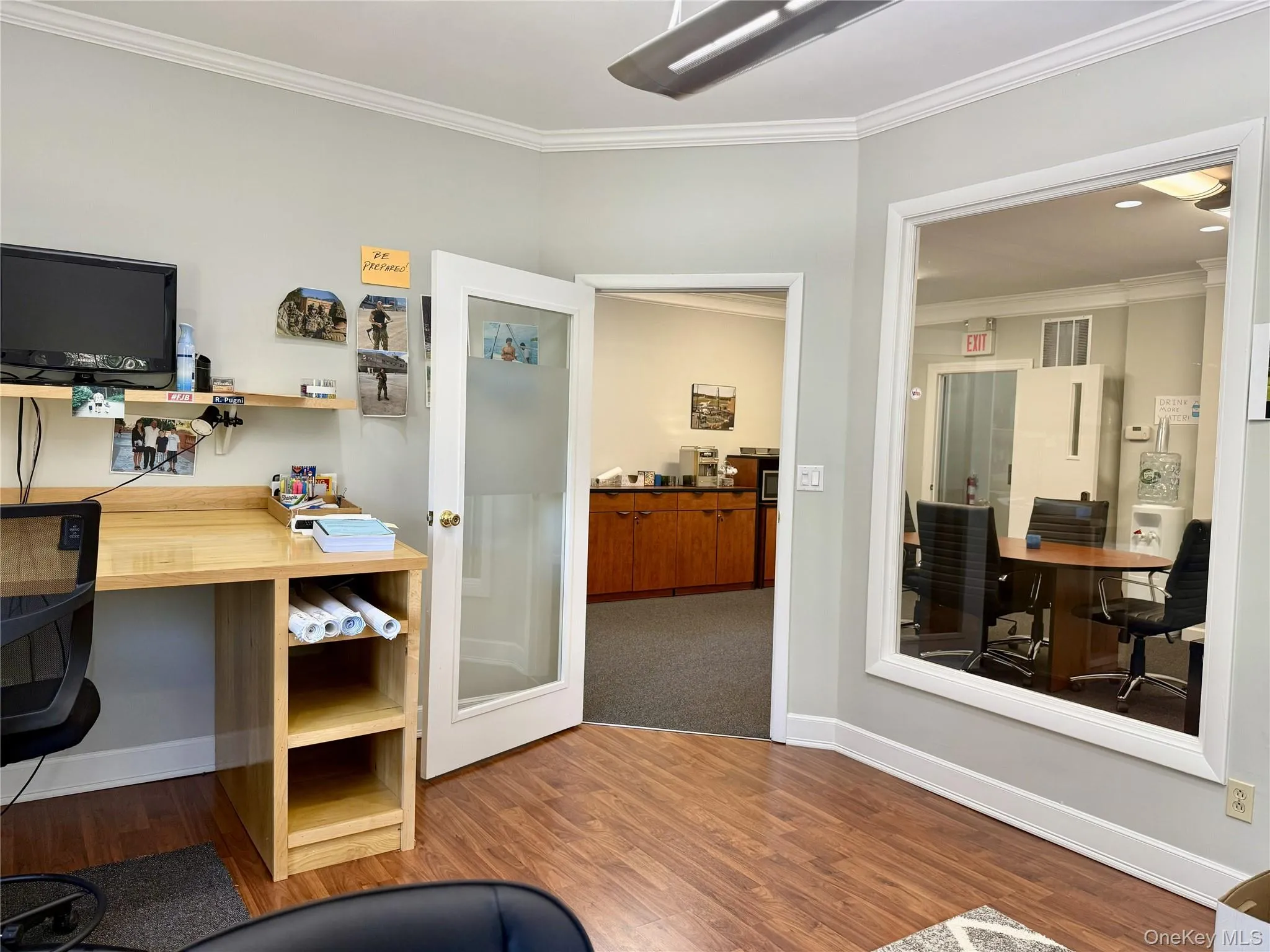 Home office with crown molding and built in study area Home office with crown molding and built in study area