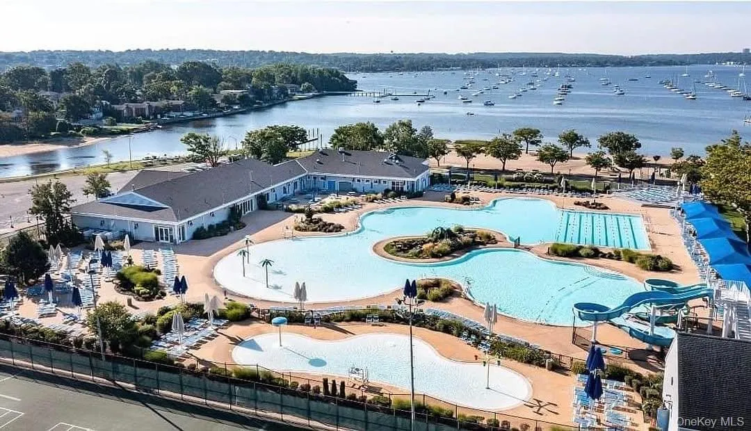 Drone / aerial view of a large body of water and a pool area Drone / aerial view of a large body of water and a pool area