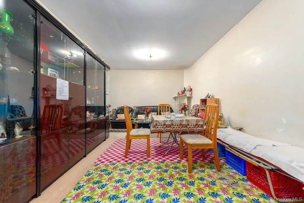 Rec room featuring light colored carpet and ornamental molding Rec room featuring light colored carpet and ornamental molding