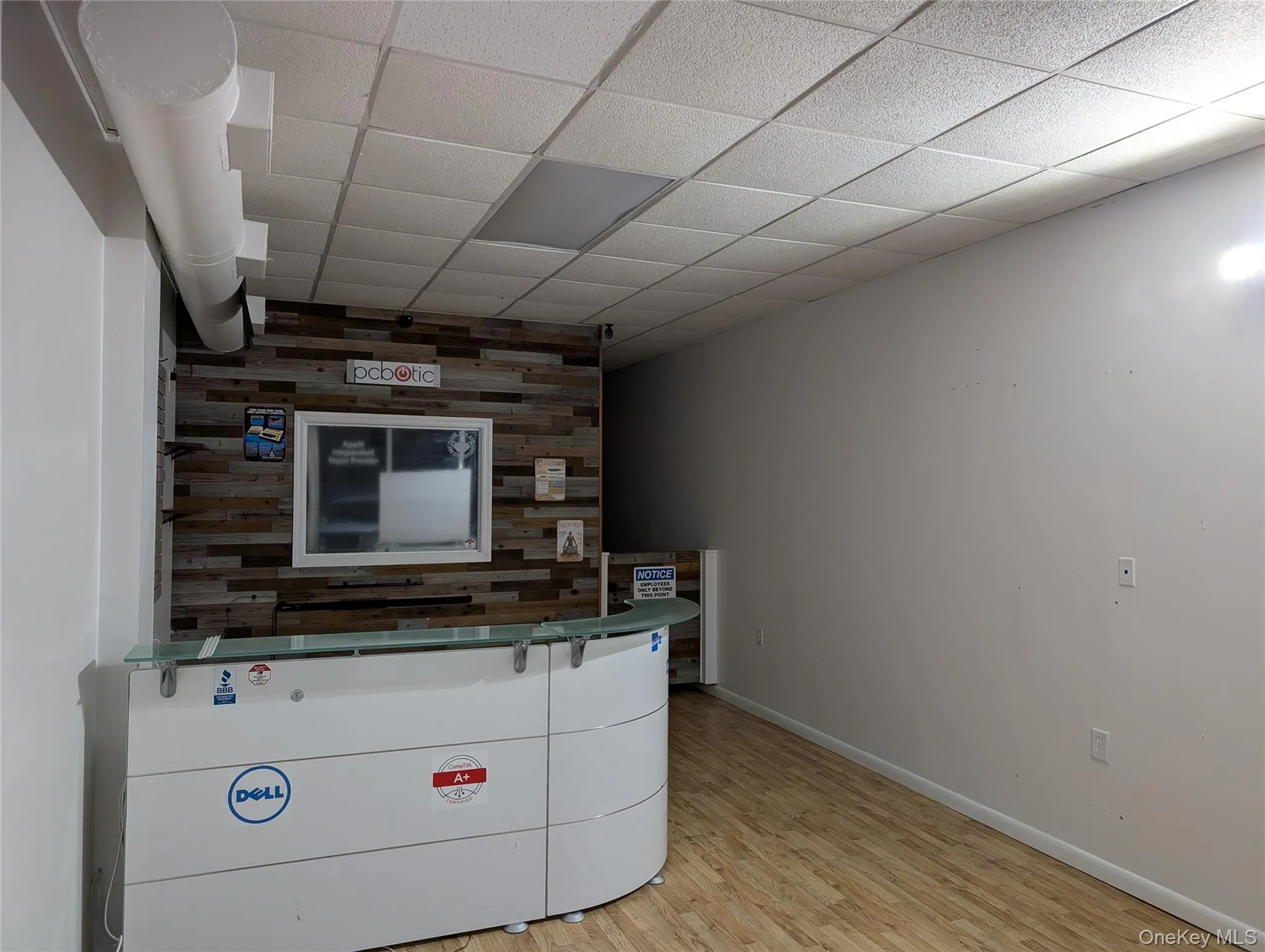 Reception area featuring a dropped paneled ceiling Reception area featuring a dropped paneled ceiling