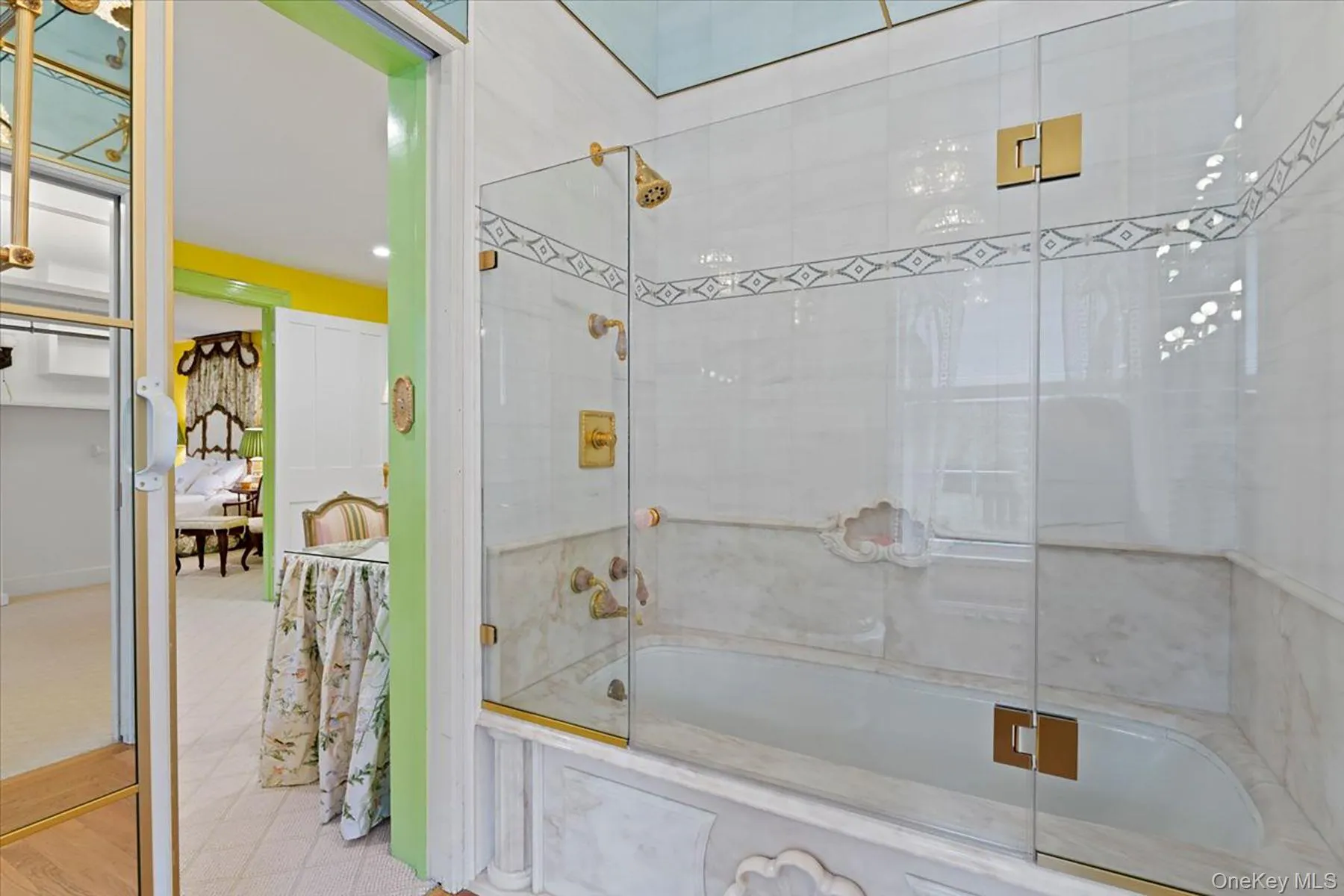 Full bath with shower / bath combination with glass door and ensuite bath Full bath with shower / bath combination with glass door and ensuite bath
