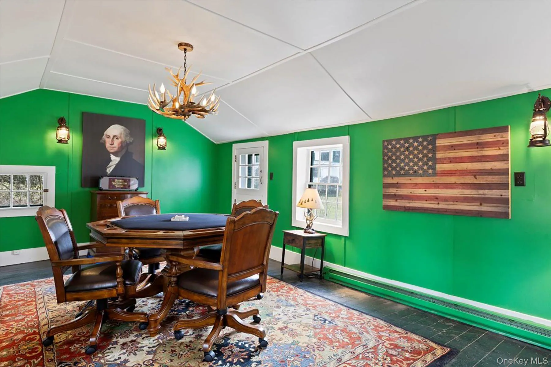 Playroom with a chandelier, lofted ceiling, and dark wood-style flooring Playroom with a chandelier, lofted ceiling, and dark wood-style flooring