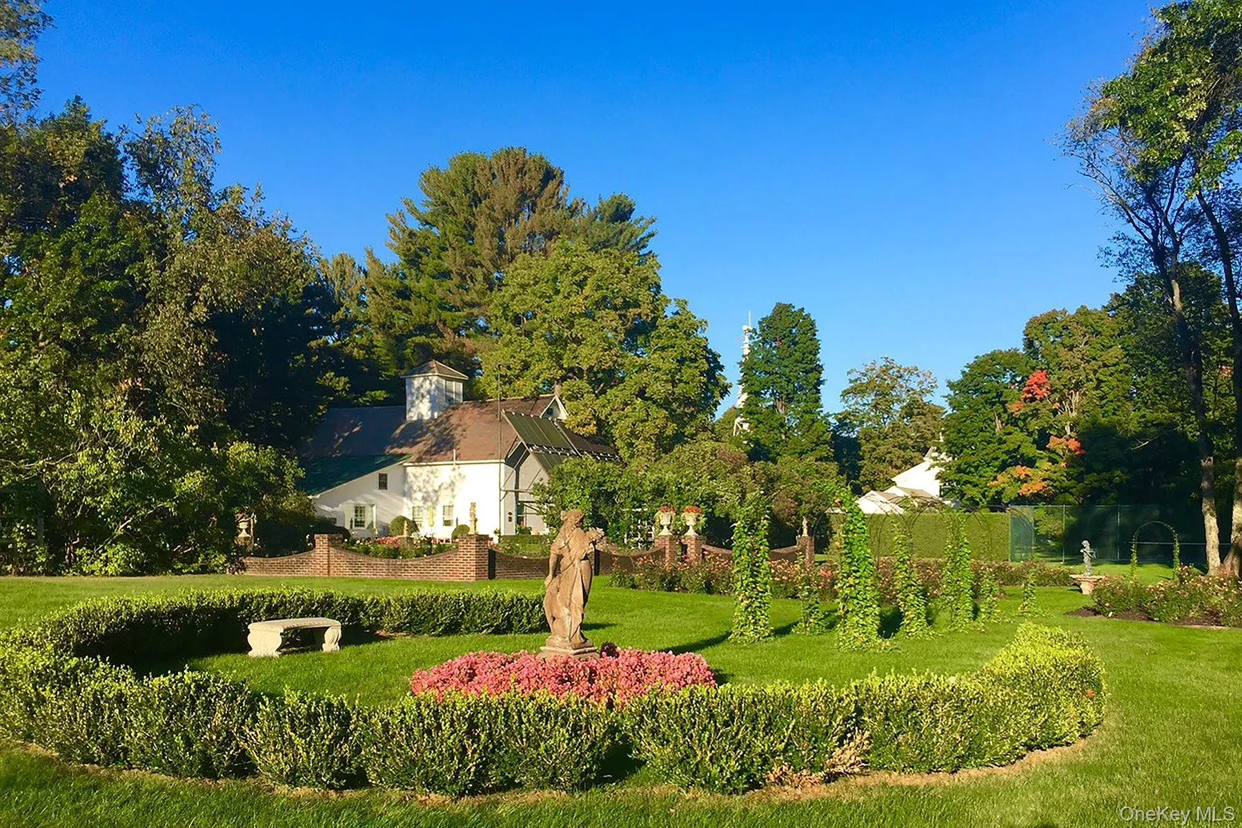 View of property's community featuring a lawn View of property's community featuring a lawn