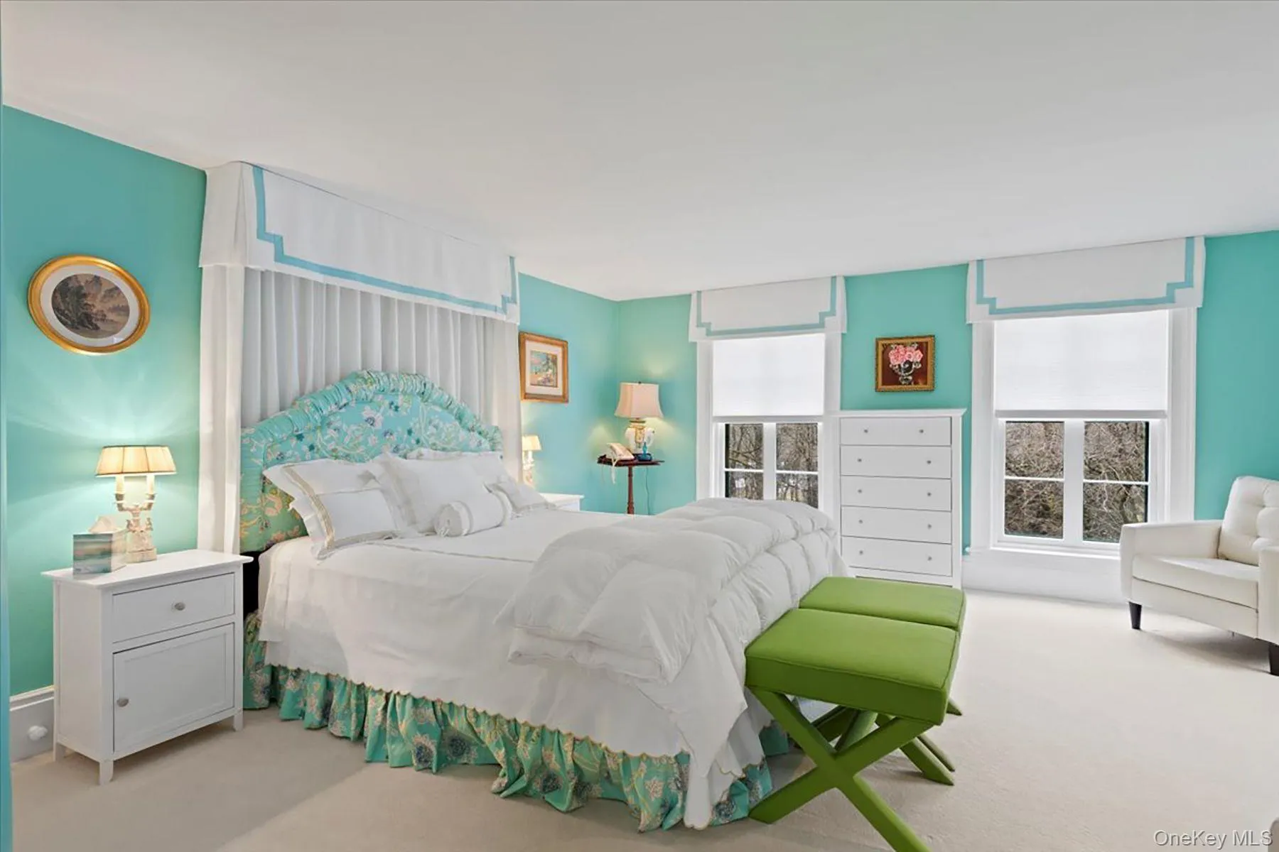 Bedroom with multiple windows and carpet flooring Bedroom with multiple windows and carpet flooring