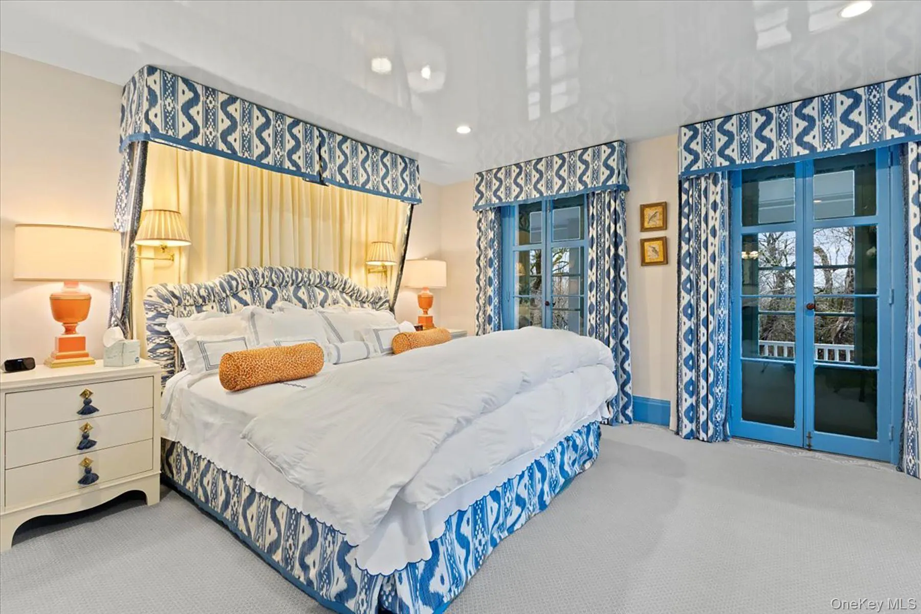 Carpeted bedroom featuring recessed lighting, access to exterior, and french doors Carpeted bedroom featuring recessed lighting, access to exterior, and french doors