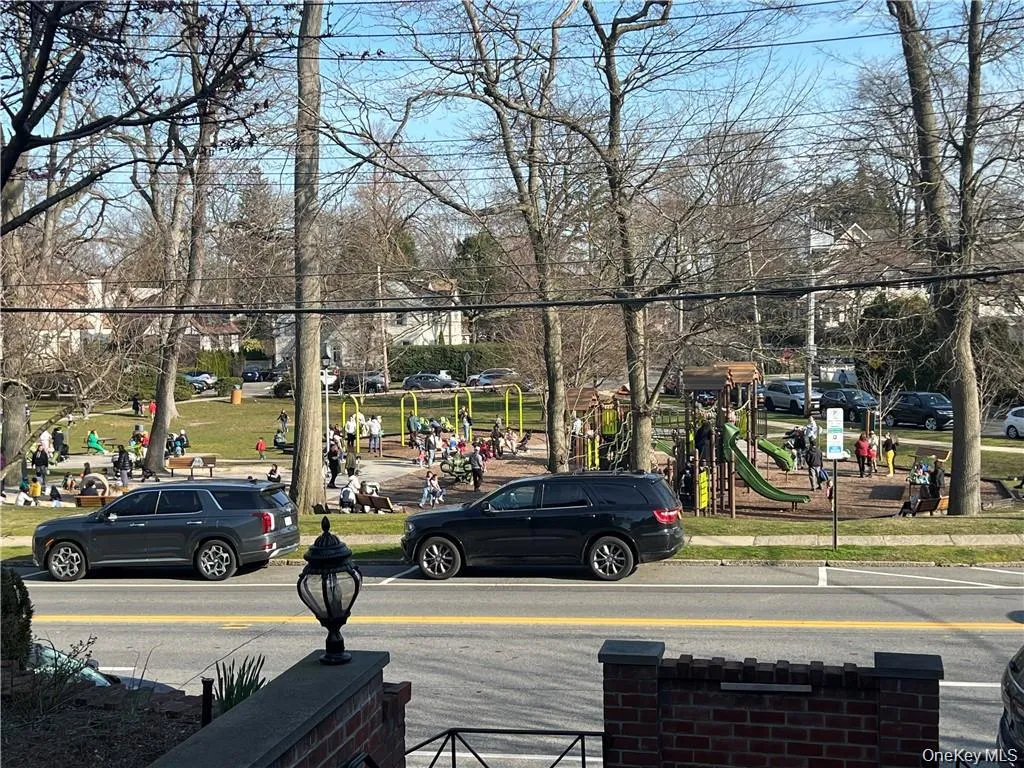 View of asphalt road featuring sidewalks View of asphalt road featuring sidewalks