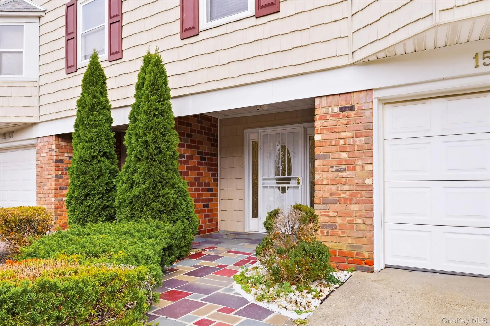 Property entrance with brick siding Property entrance with brick siding