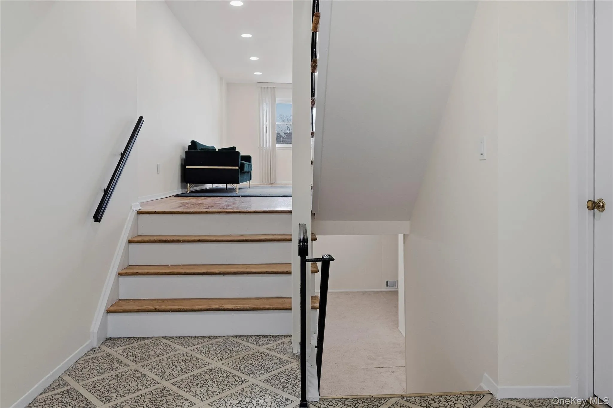 Staircase featuring recessed lighting and baseboards Staircase featuring recessed lighting and baseboards