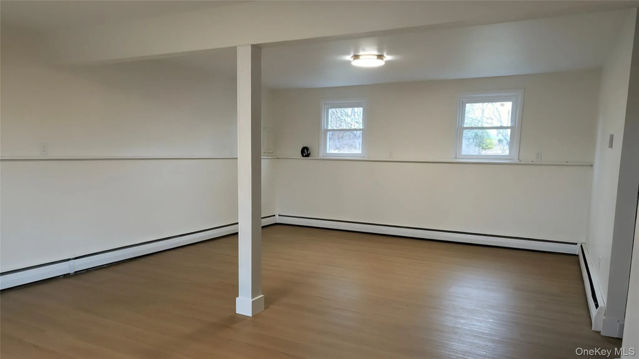 Finished lower level with a half bath and laundry room. Sliders to the backyard Finished lower level with a half bath and laundry room. Sliders to the backyard