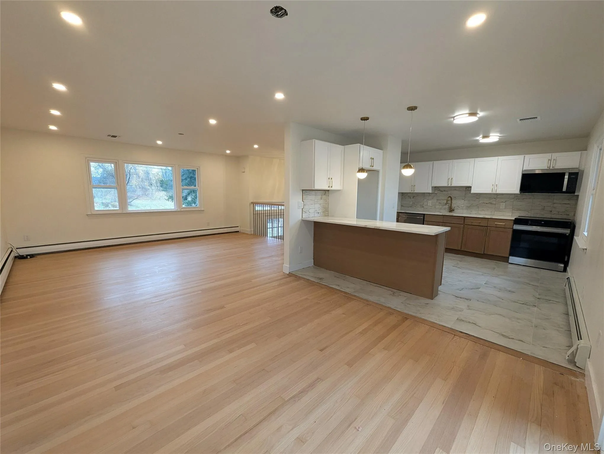 Dining area looking into the kitchen and living room offering a nice open concept. Dining area looking into the kitchen and living room offering a nice open concept.