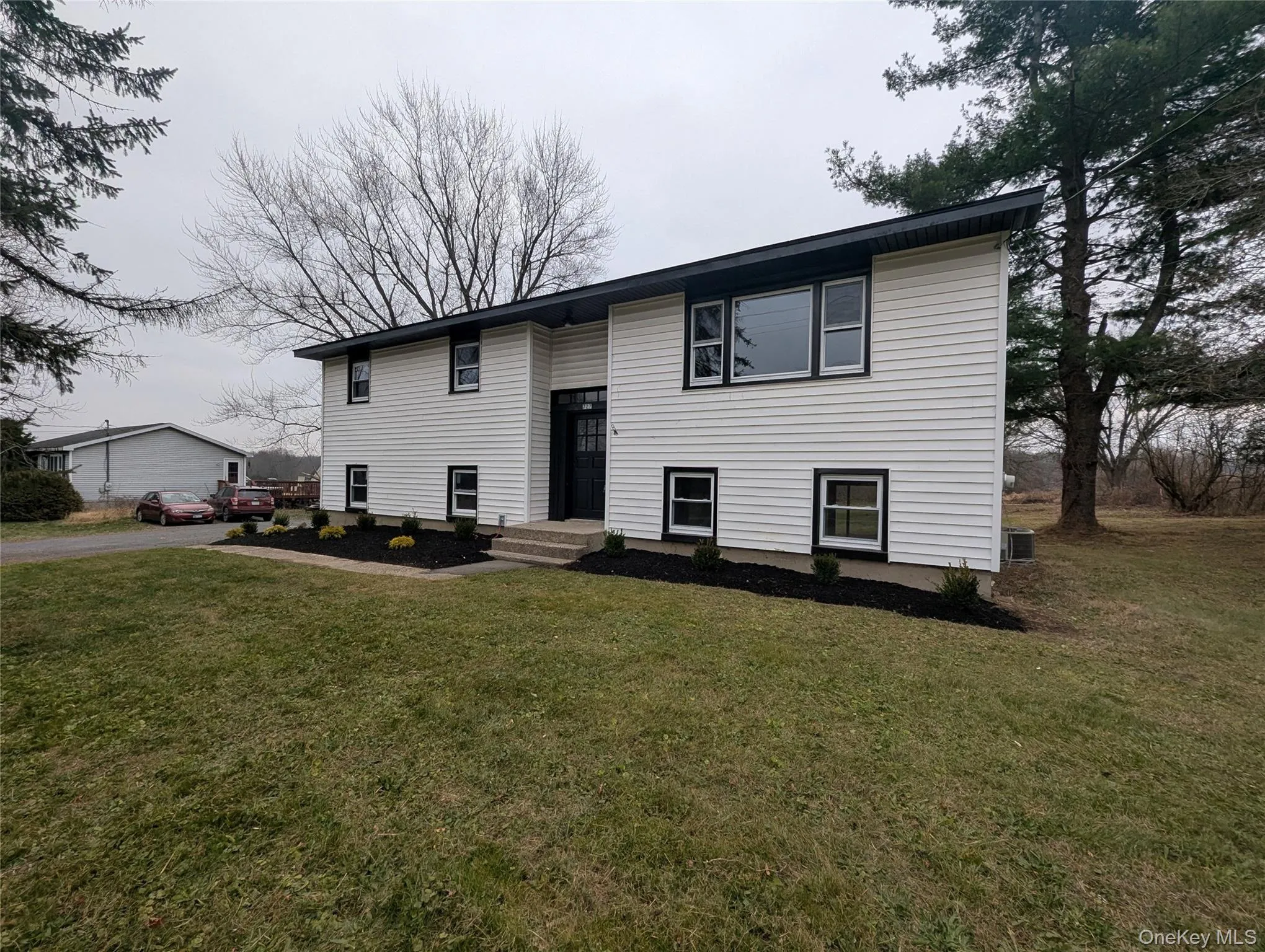 Bi-level home with a front yard Bi-level home with a front yard