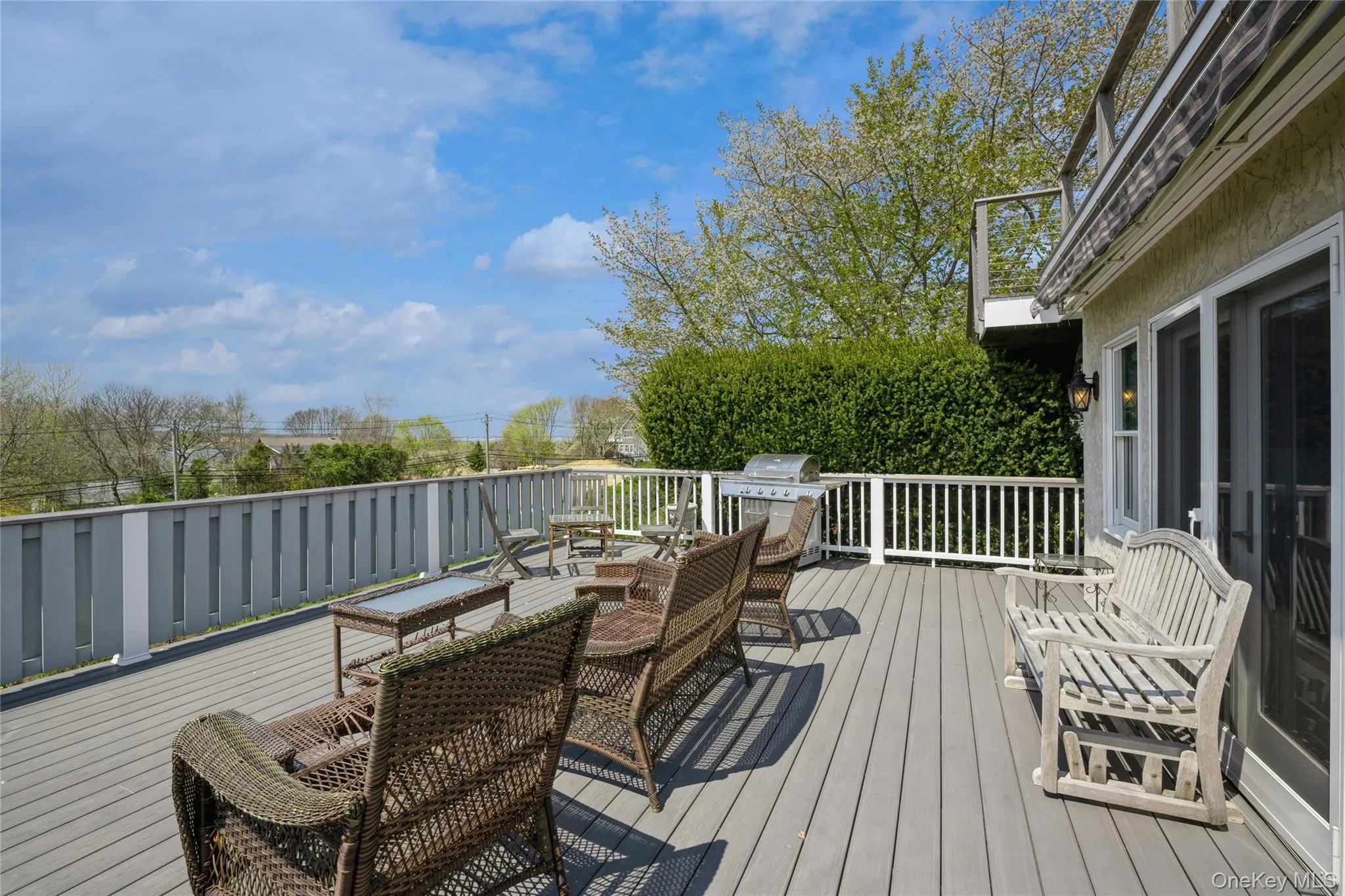 Wooden deck featuring area for grilling Wooden deck featuring area for grilling