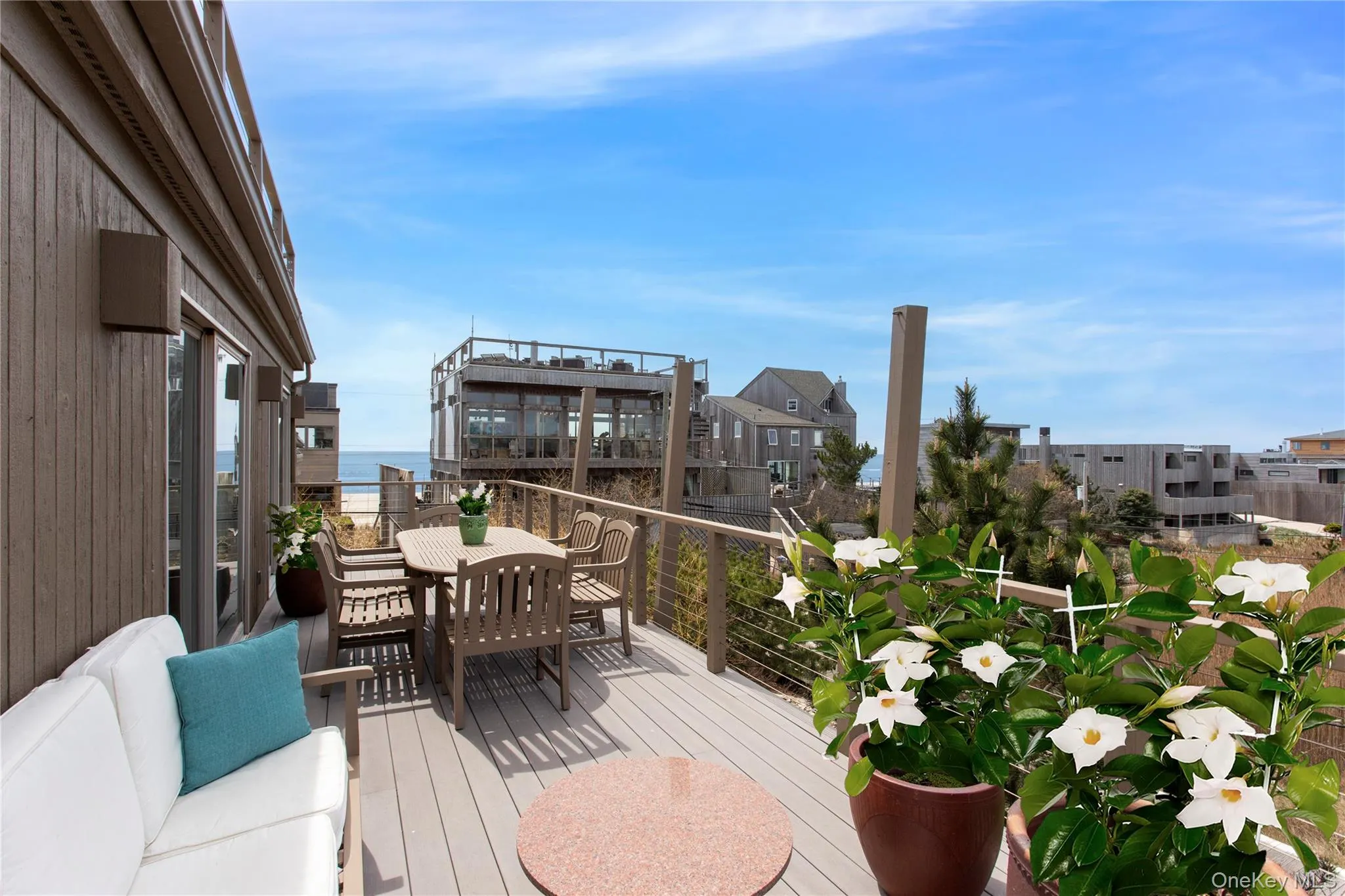 Deck featuring outdoor dining area and a residential view Deck featuring outdoor dining area and a residential view