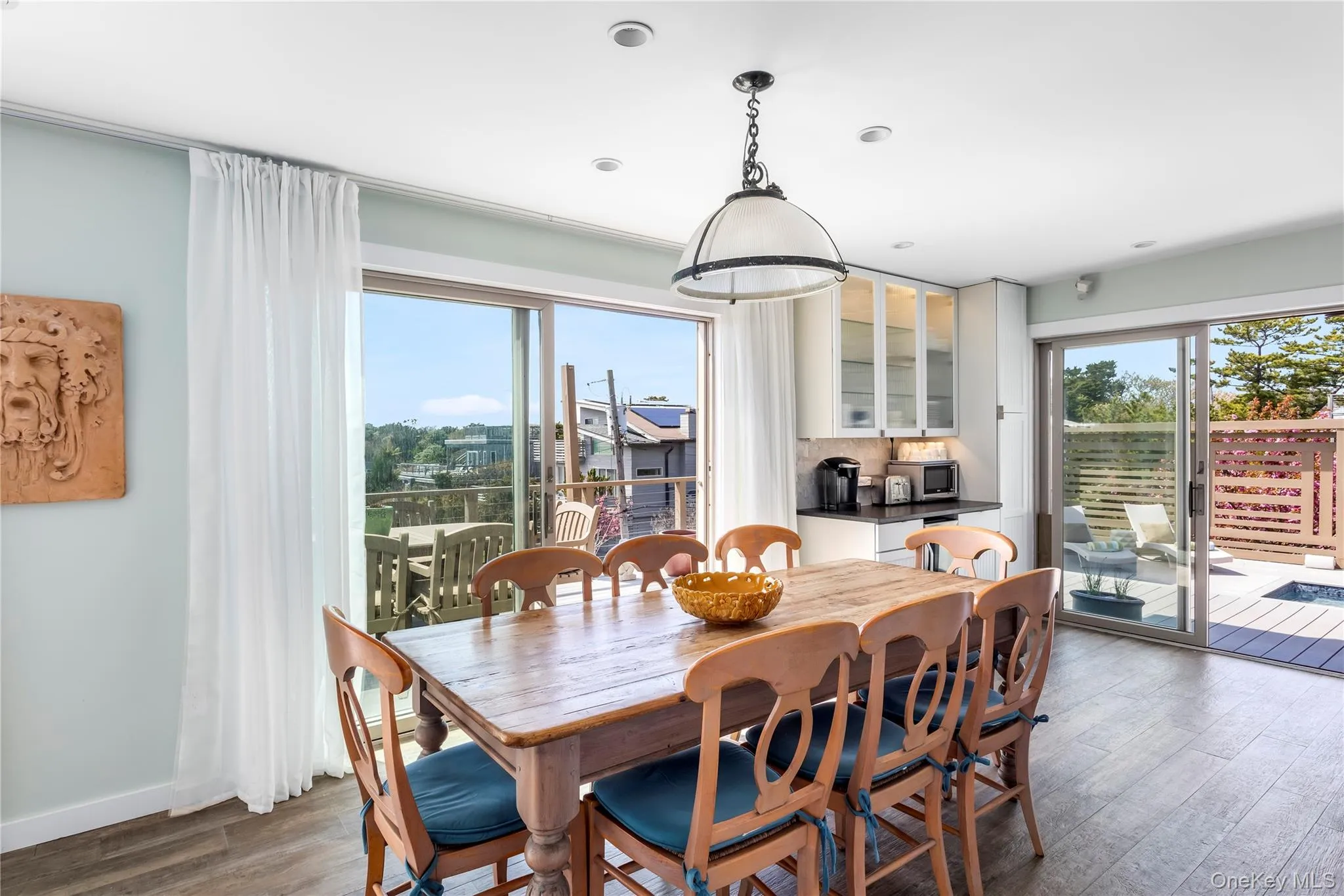 Dining room with dark wood-type flooring and baseboards Dining room with dark wood-type flooring and baseboards