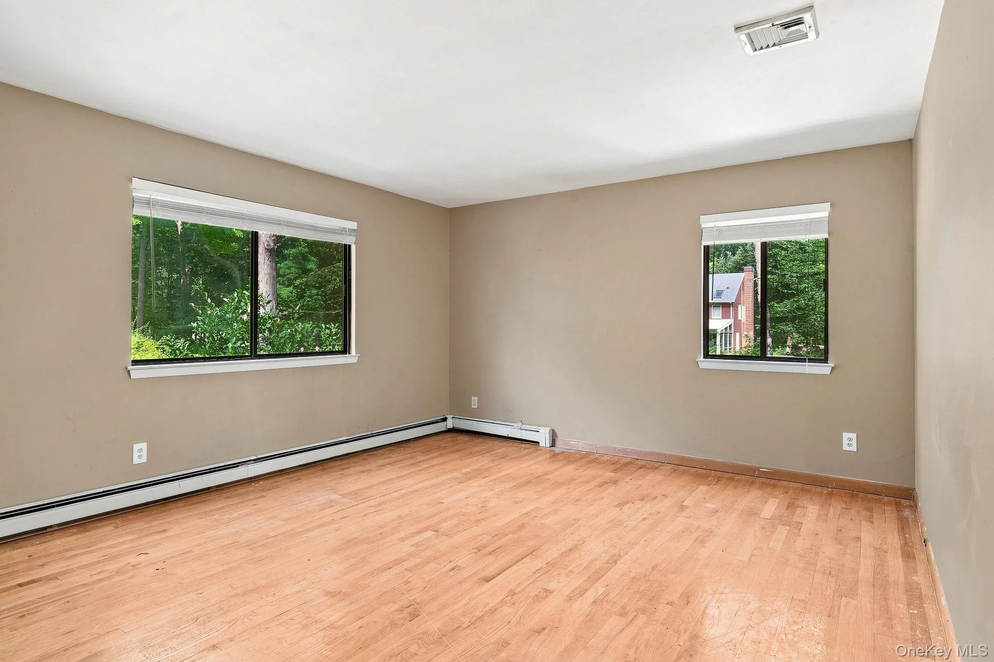 Wood-finish flooring with neutral wall tones Wood-finish flooring with neutral wall tones