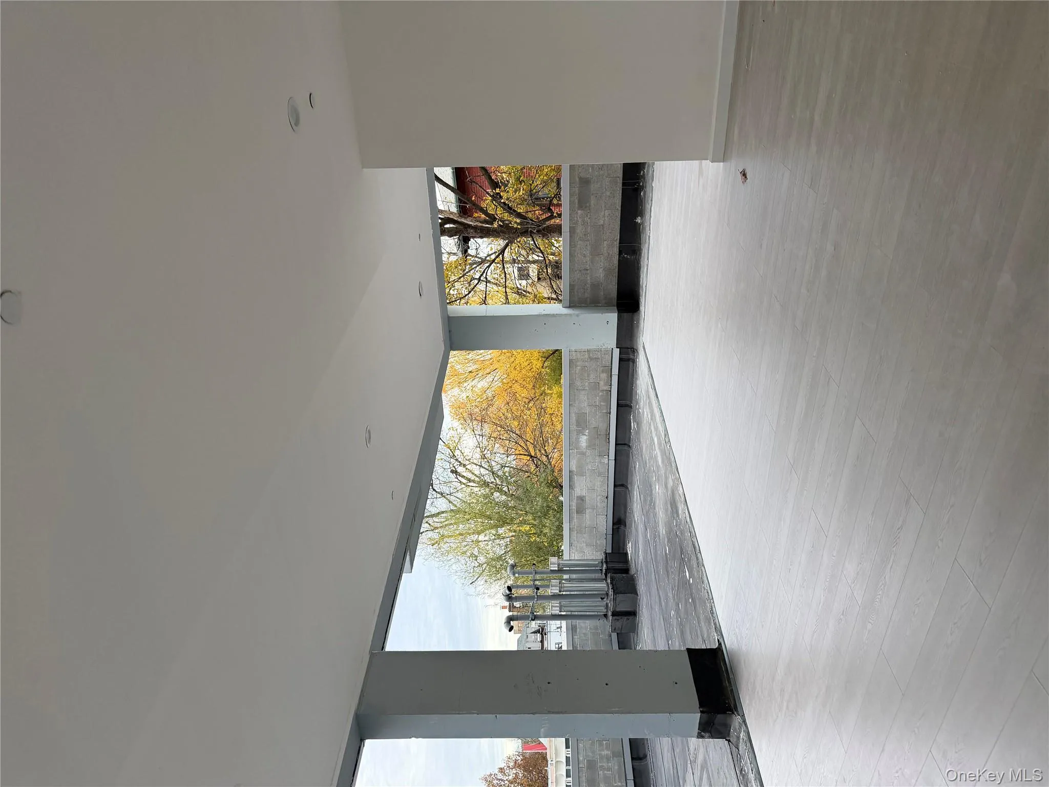 Unfurnished room featuring light wood finished floors and baseboards Unfurnished room featuring light wood finished floors and baseboards