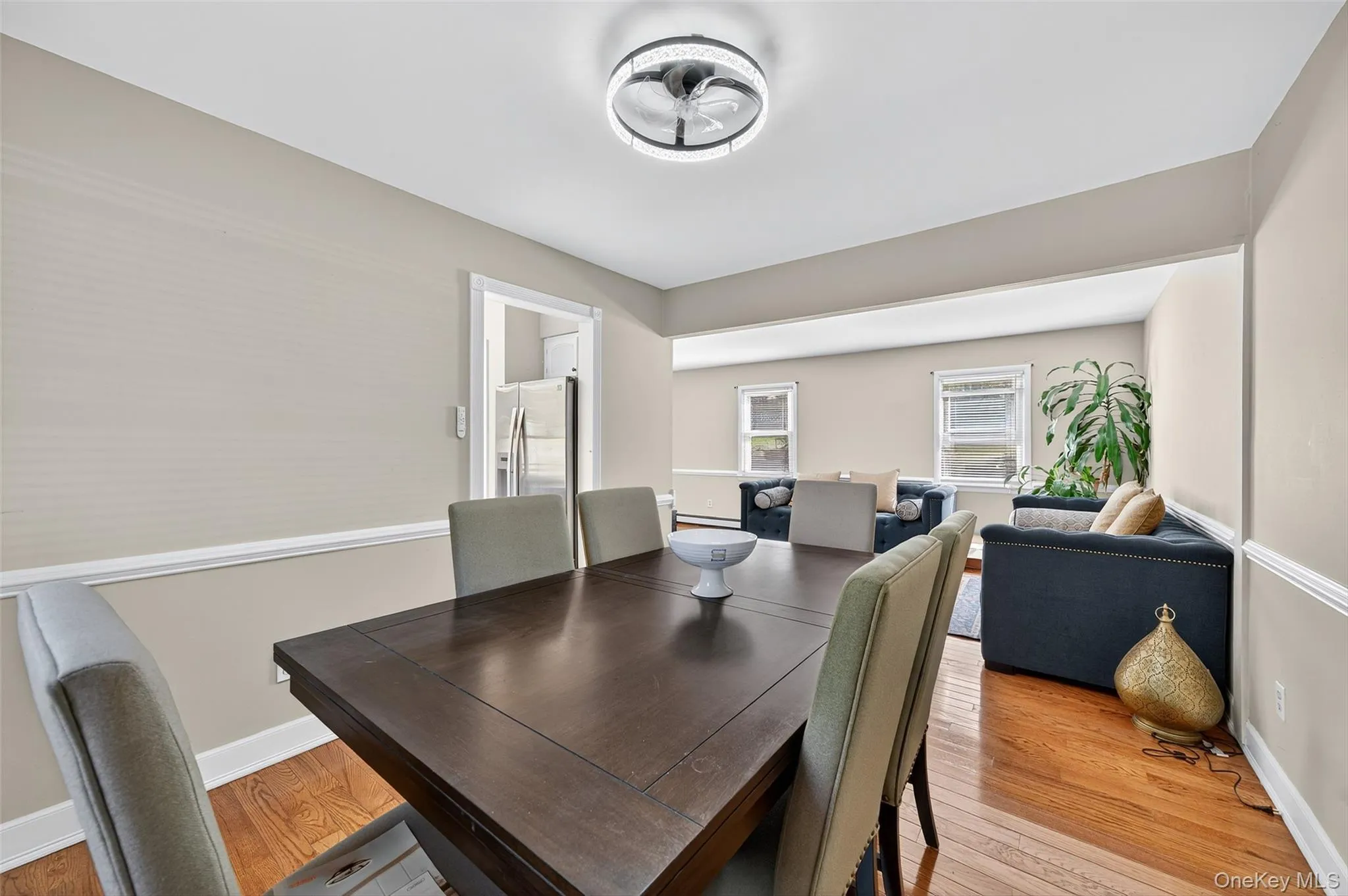Dining area featuring light wood-style flooring and baseboards Dining area featuring light wood-style flooring and baseboards