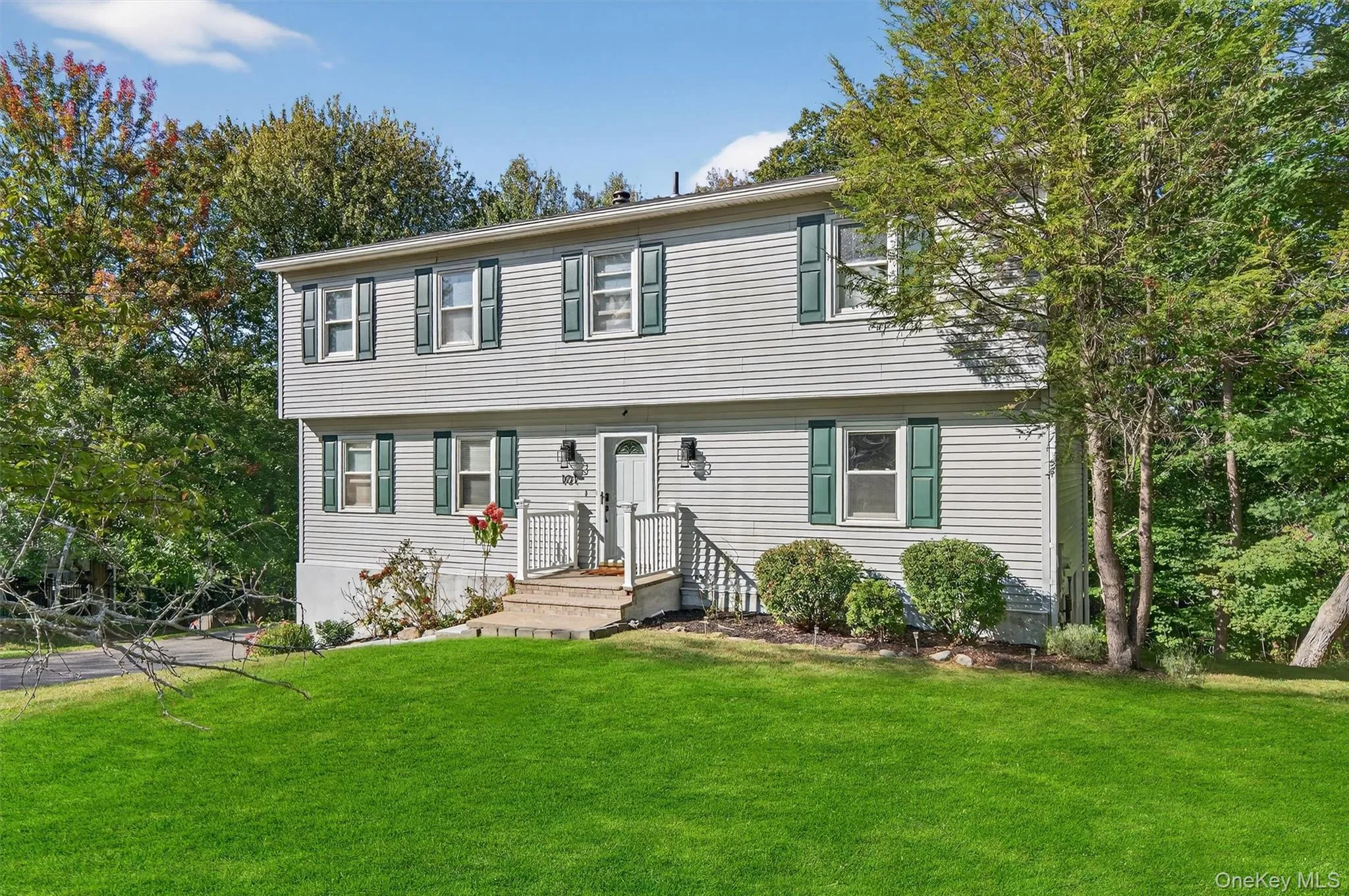 Colonial house with a front lawn Colonial house with a front lawn
