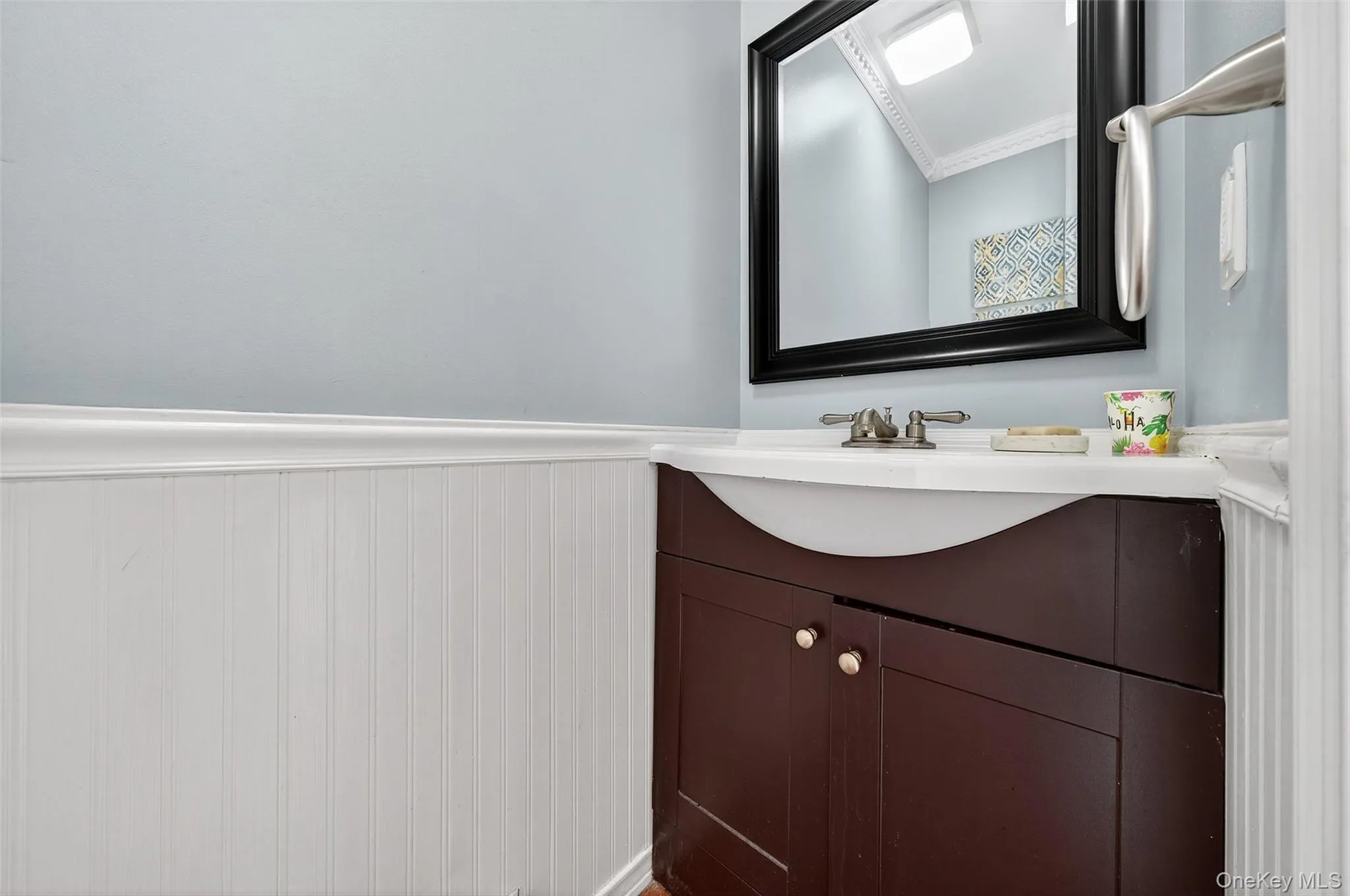 Bathroom with vanity and wainscoting Bathroom with vanity and wainscoting
