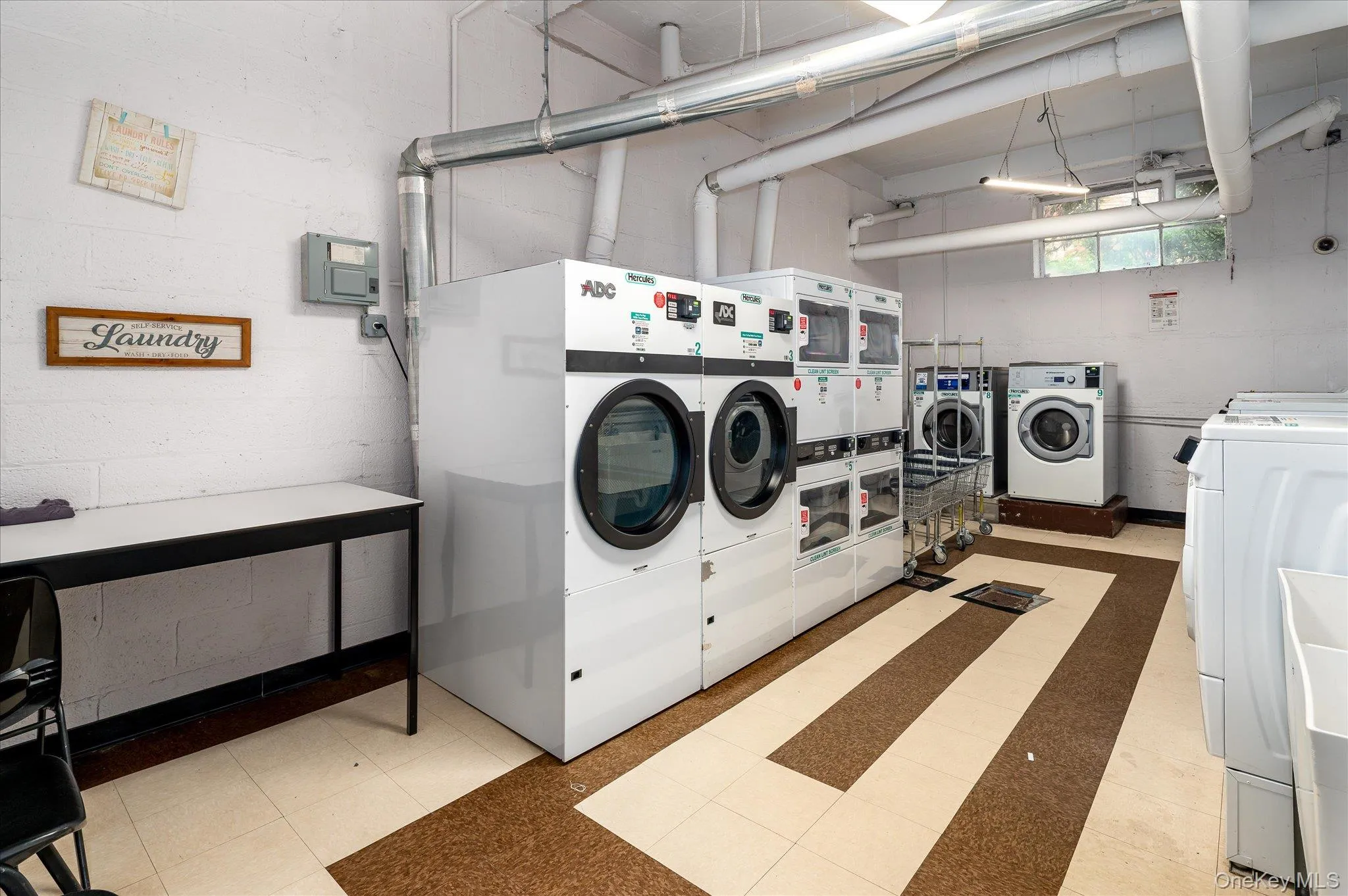 Community laundry with washing machine and dryer Community laundry with washing machine and dryer