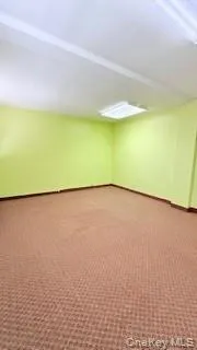 Basement featuring carpet floors and baseboards Basement featuring carpet floors and baseboards