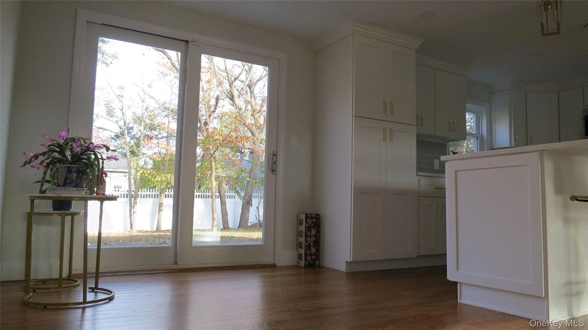 Unfurnished dining area featuring dark wood-style floors Unfurnished dining area featuring dark wood-style floors