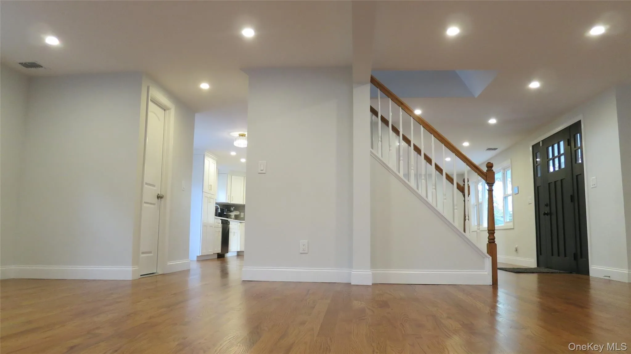 Entrance foyer with recessed lighting, stairs, and light wood-type flooring Entrance foyer with recessed lighting, stairs, and light wood-type flooring