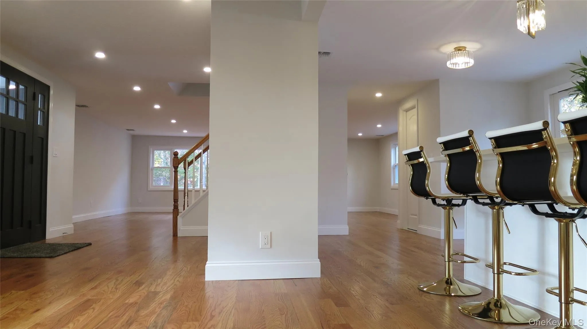 Entrance foyer featuring light wood-style flooring, recessed lighting, and stairway Entrance foyer featuring light wood-style flooring, recessed lighting, and stairway