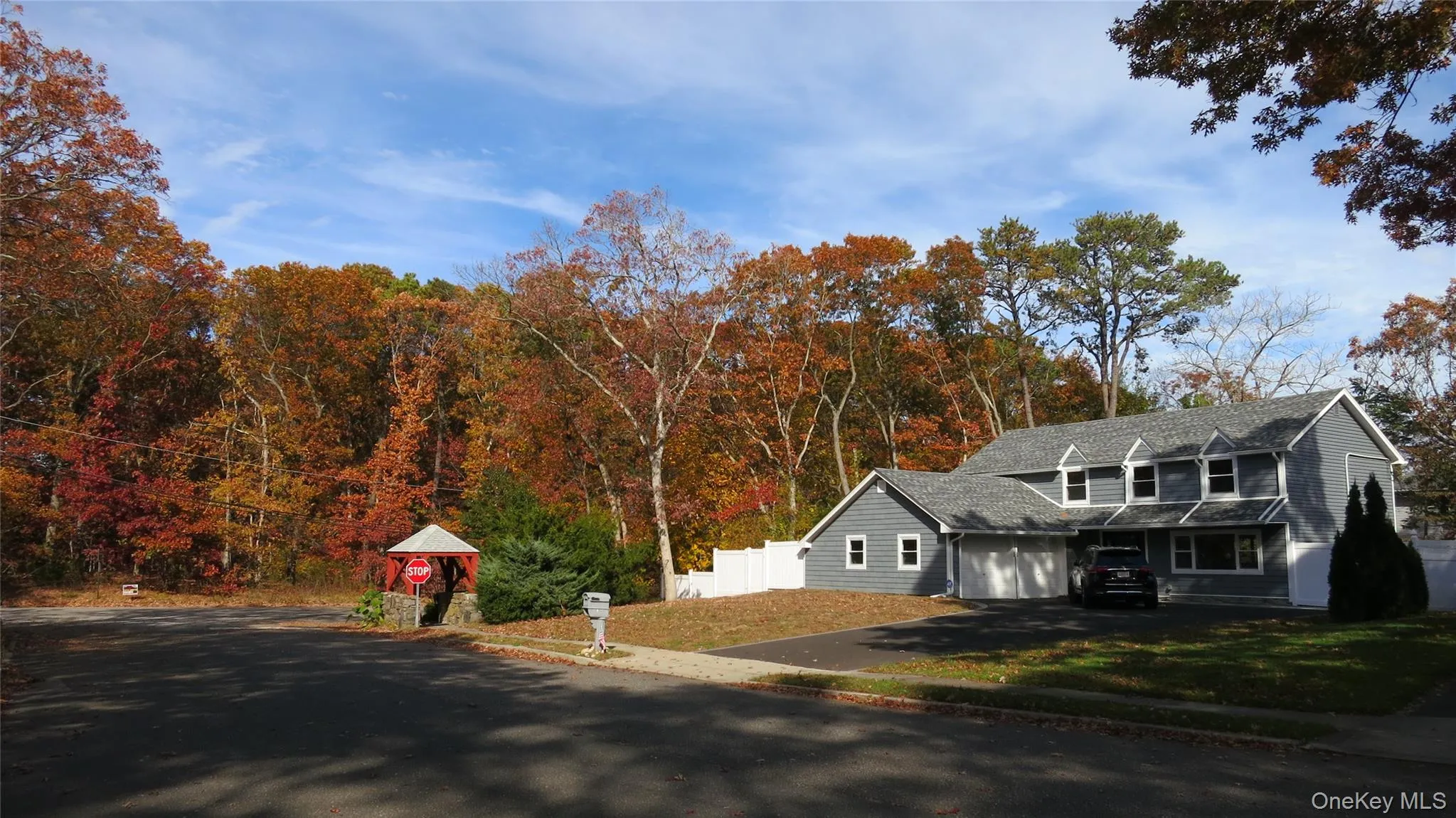 View of front of property featuring asphalt driveway View of front of property featuring asphalt driveway