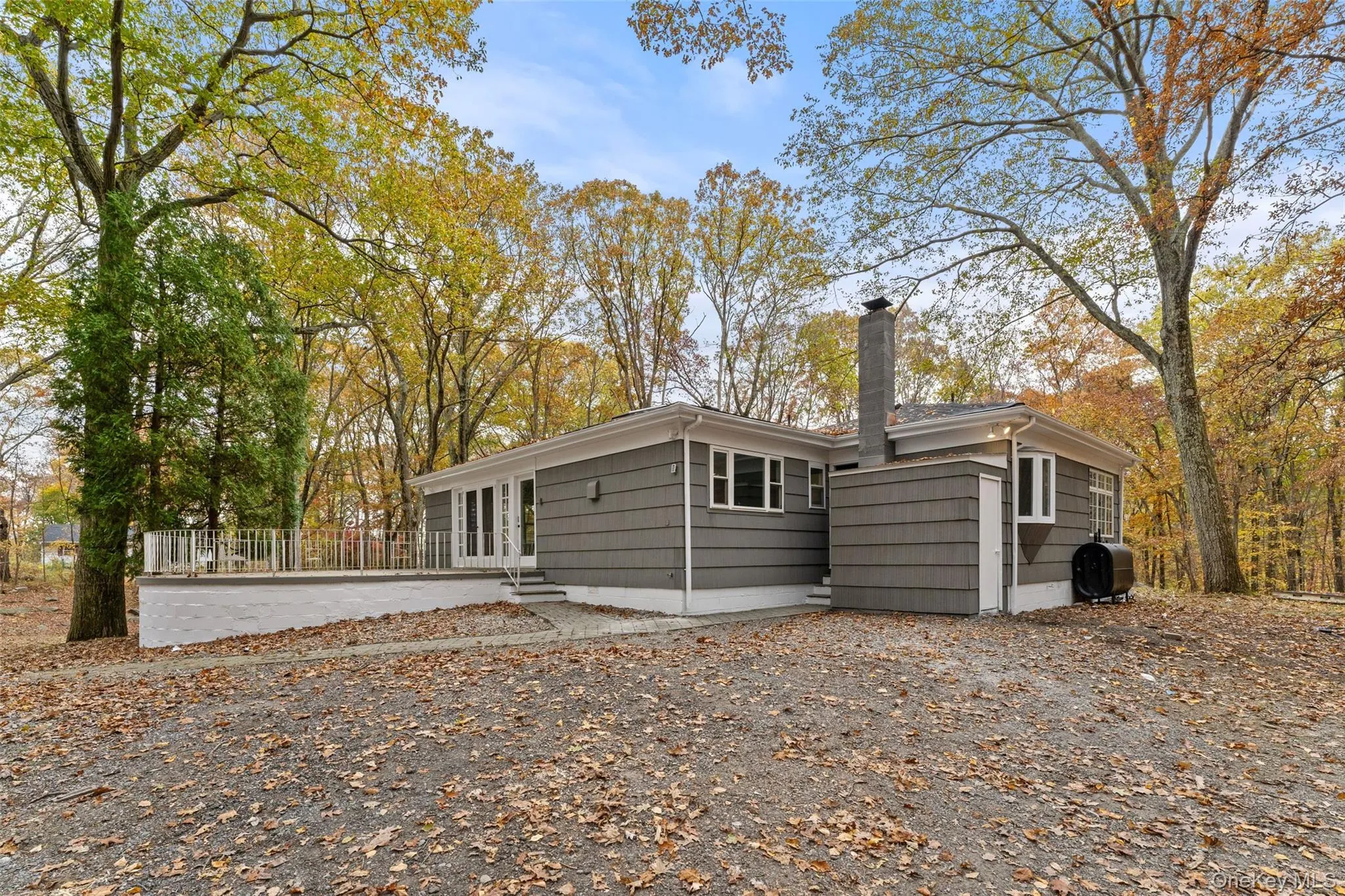 54 De Liso: Back of house featuring a chimney and oil tank 54 De Liso: Back of house featuring a chimney and oil tank