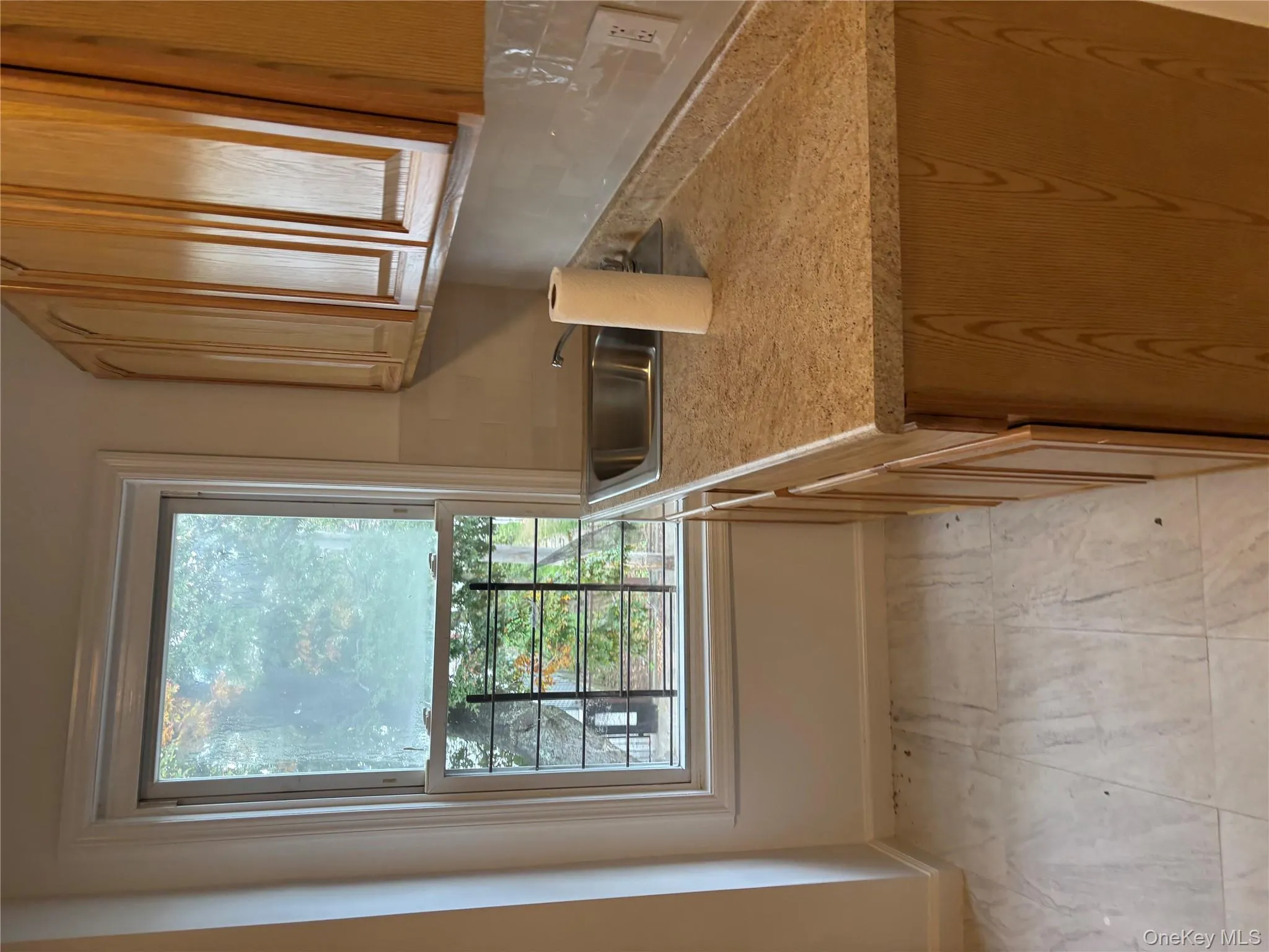 Kitchen featuring light countertops and a sink Kitchen featuring light countertops and a sink