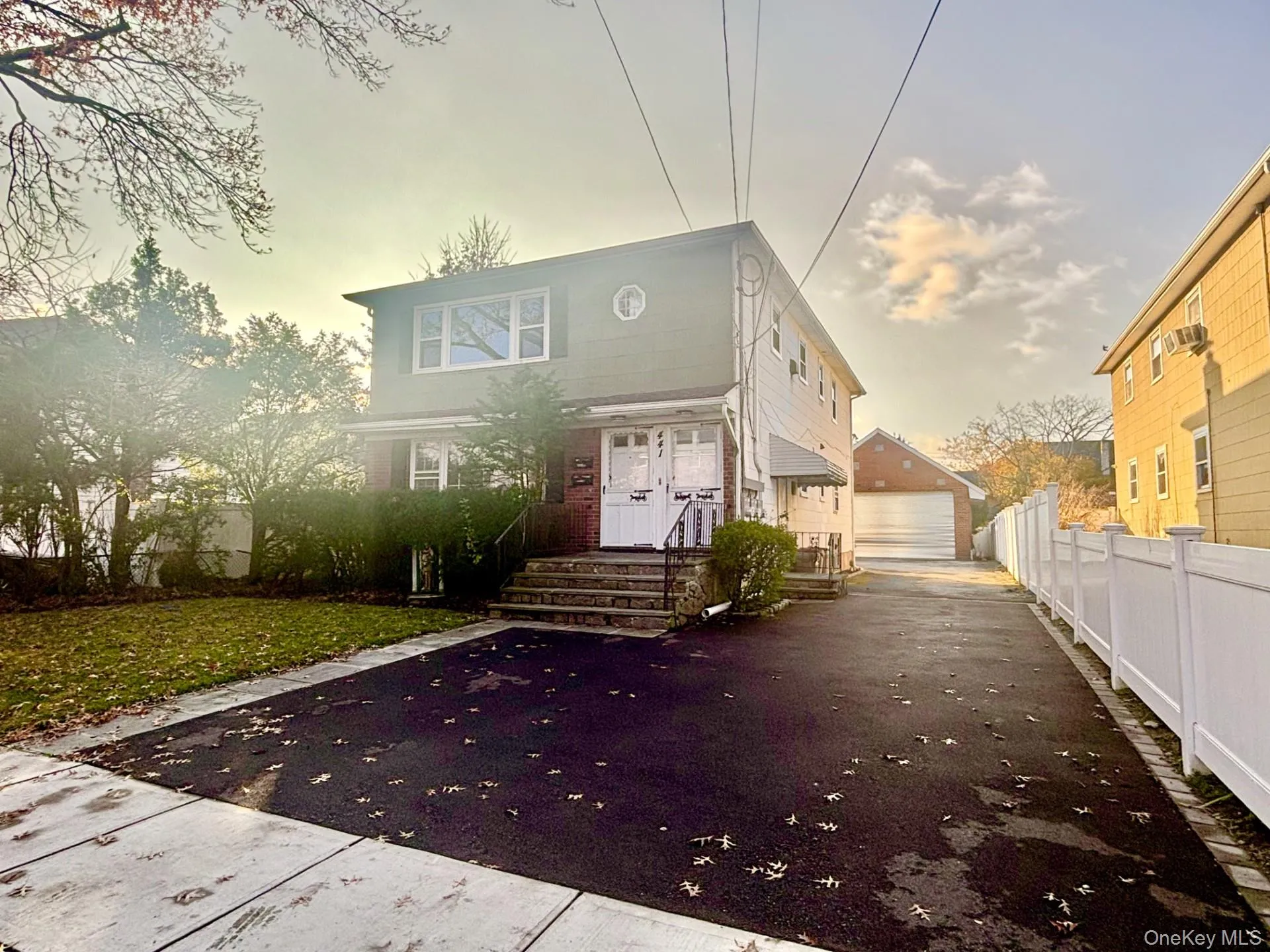 View of front of home with a garage and an outbuilding View of front of home with a garage and an outbuilding