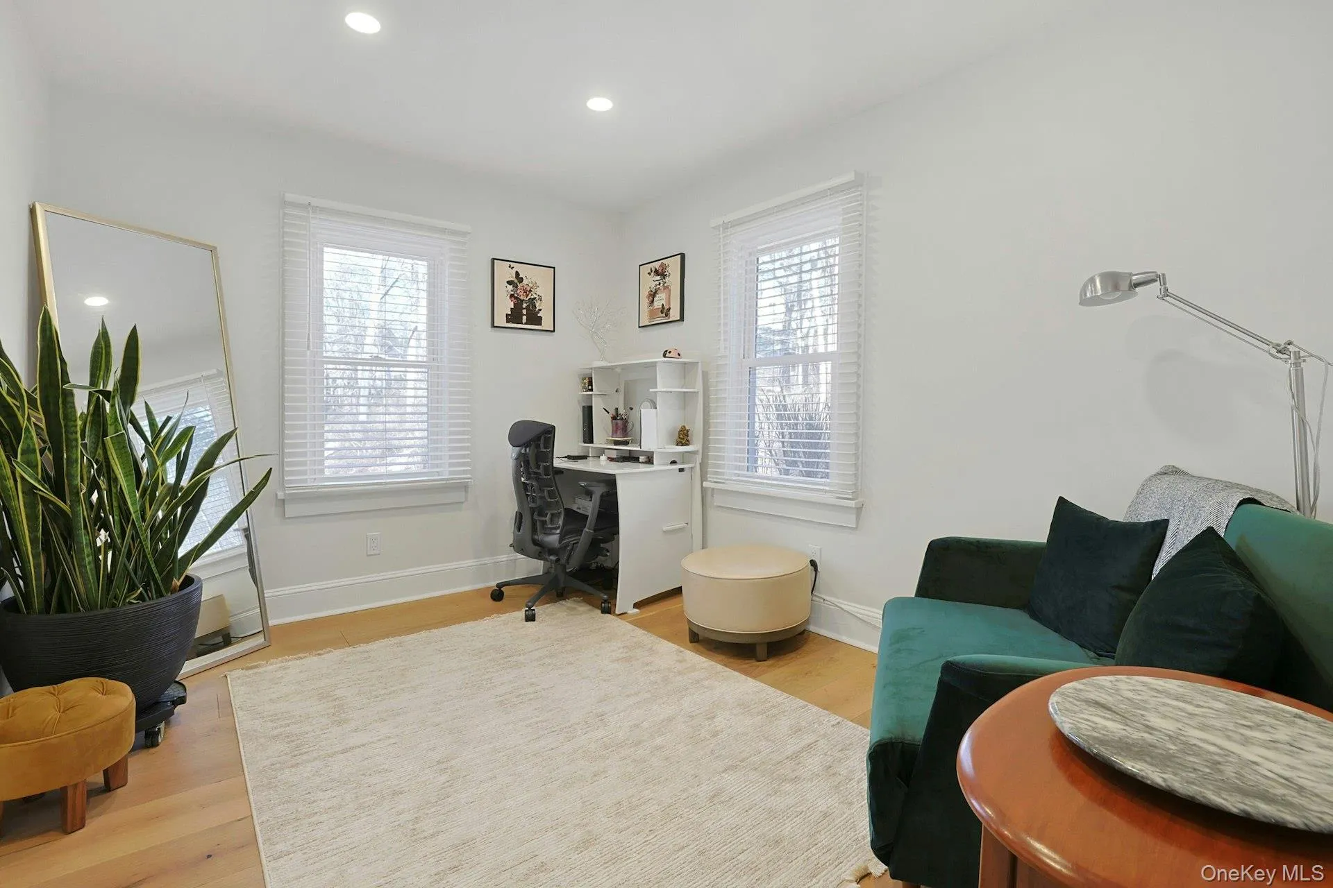 Second bedroom currently used as an office featuring light wood-style flooring and recessed lighting Second bedroom currently used as an office featuring light wood-style flooring and recessed lighting