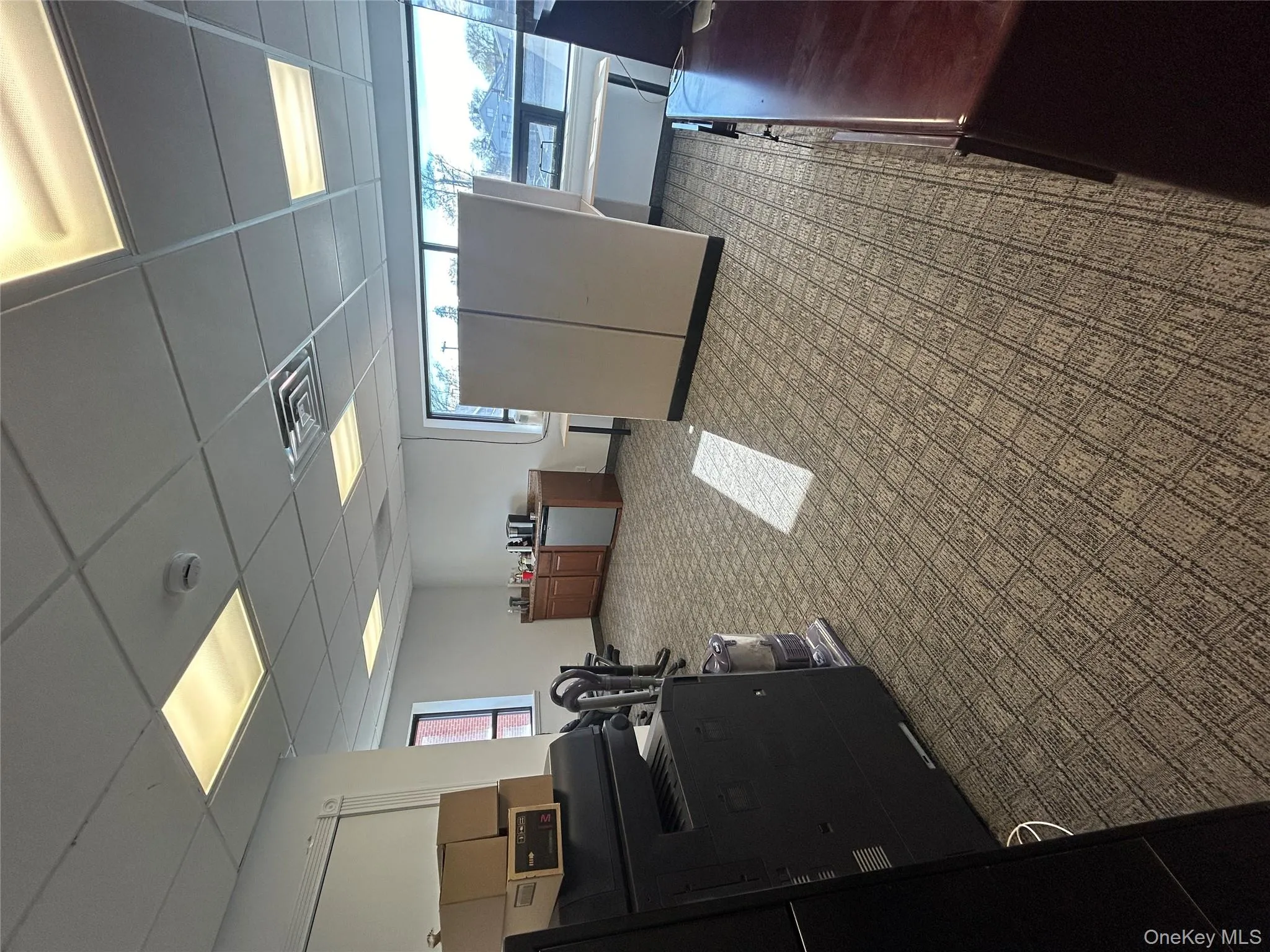 Office with a paneled ceiling and plenty of natural light Office with a paneled ceiling and plenty of natural light