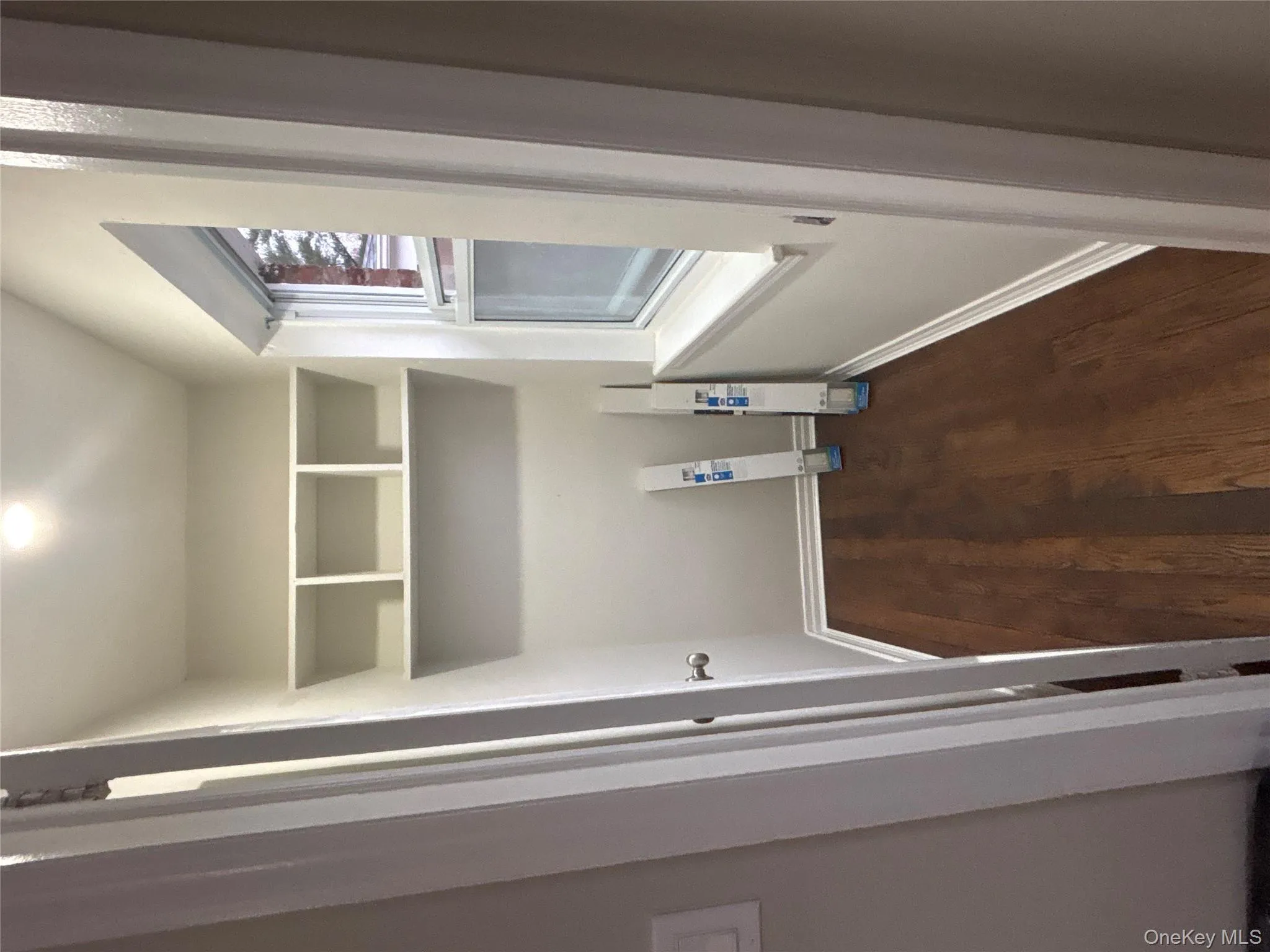 Washroom featuring dark wood-style floors and baseboards Washroom featuring dark wood-style floors and baseboards