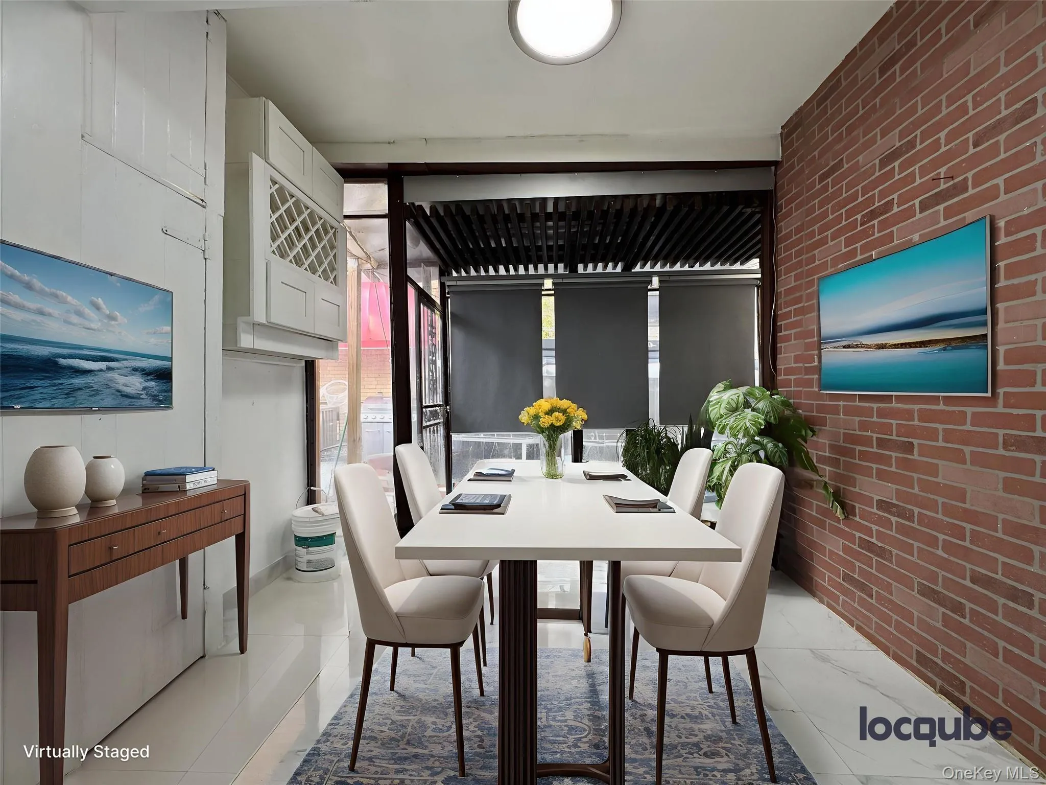 Dining room featuring brick wall and light tile patterned floors Dining room featuring brick wall and light tile patterned floors
