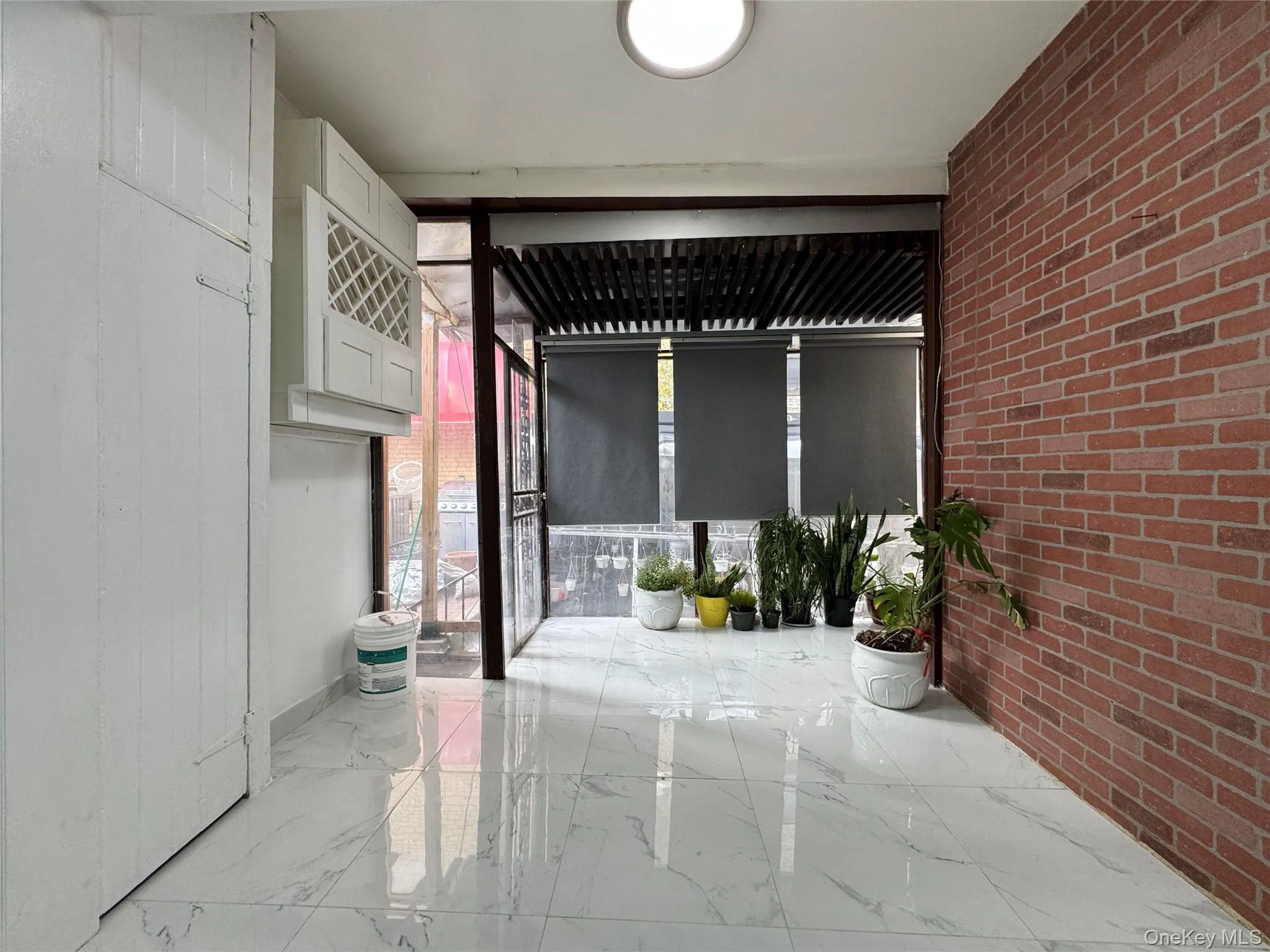View of patio / terrace with a sunroom View of patio / terrace with a sunroom