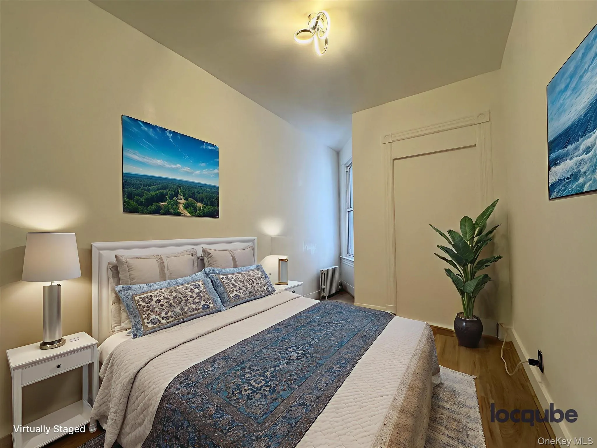 Bedroom with wood finished floors and radiator Bedroom with wood finished floors and radiator