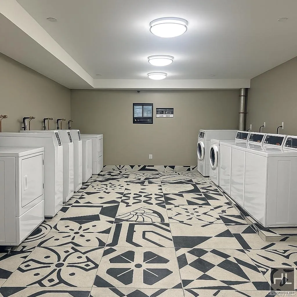 Shared laundry featuring washing machine and dryer Shared laundry featuring washing machine and dryer