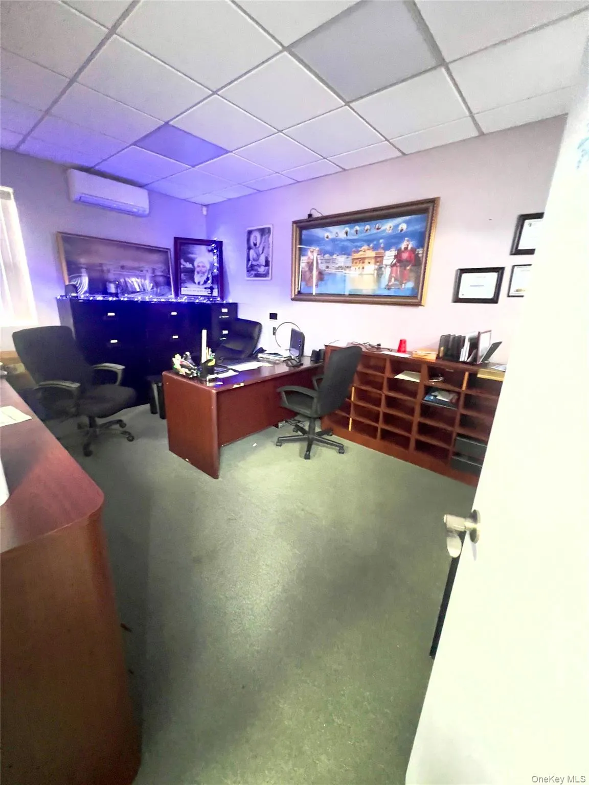 Home office with a drop ceiling and an AC wall unit Home office with a drop ceiling and an AC wall unit