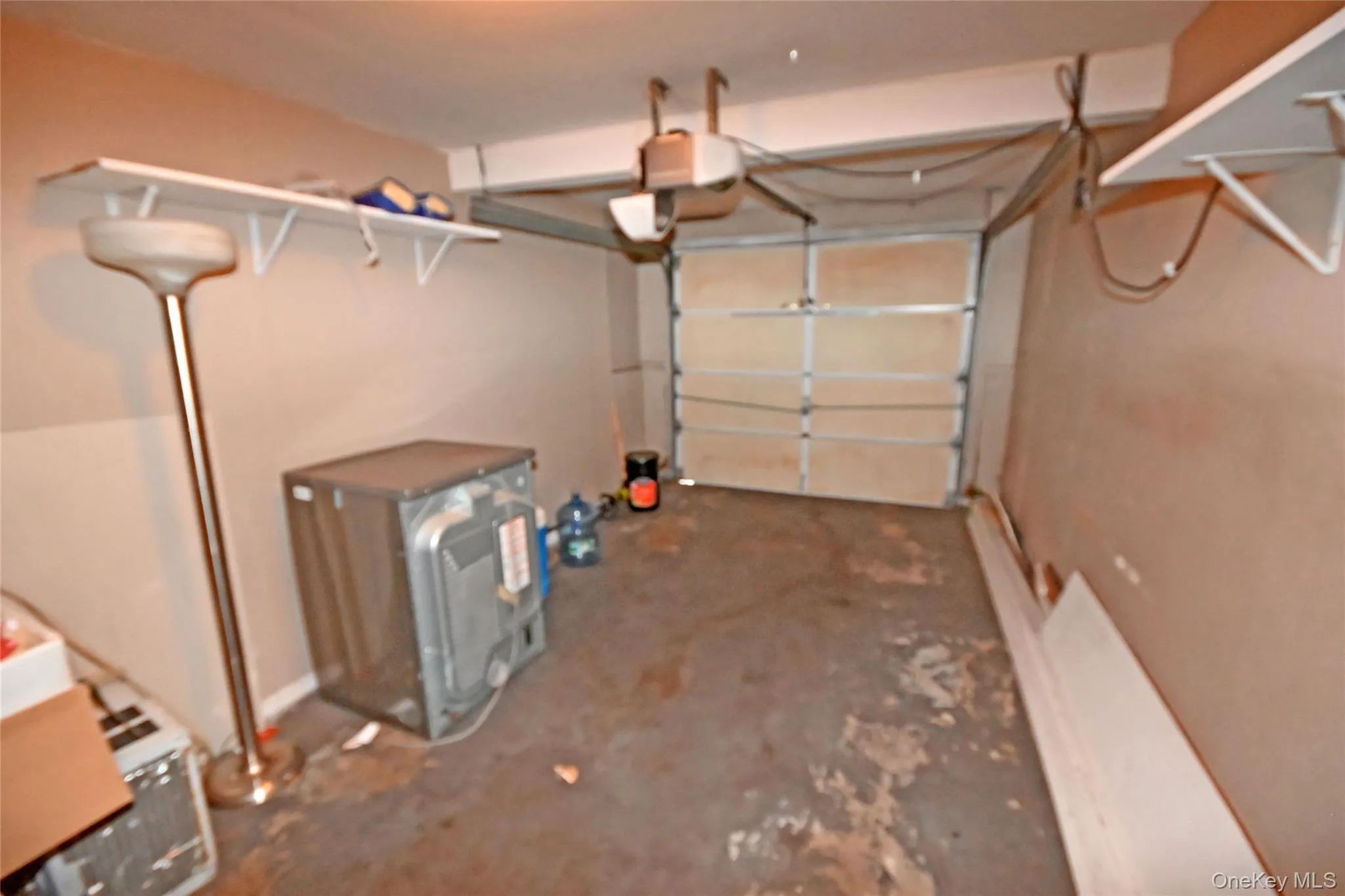 Garage featuring a garage door opener Garage featuring a garage door opener